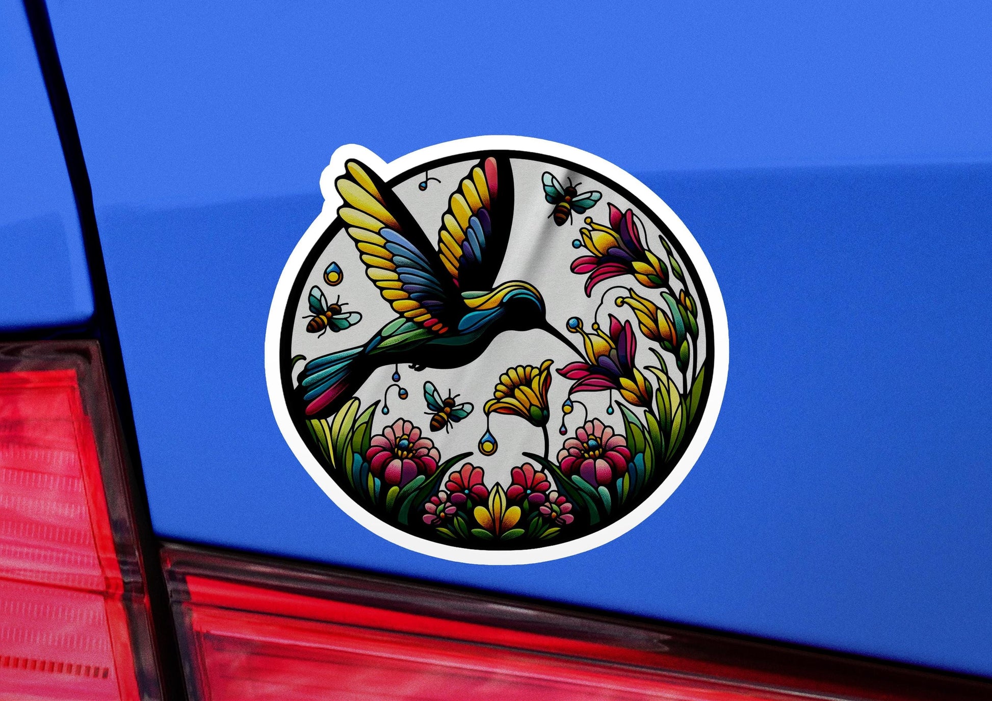 a sticker on the back of a blue car