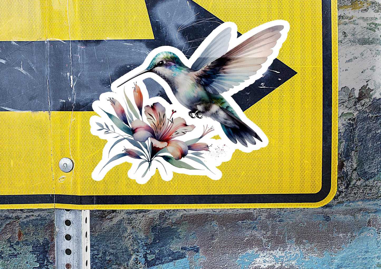 a sticker of a hummingbird on a street sign