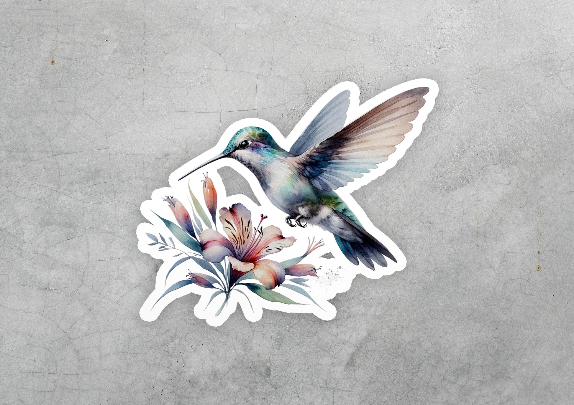 a sticker of a hummingbird with flowers on it