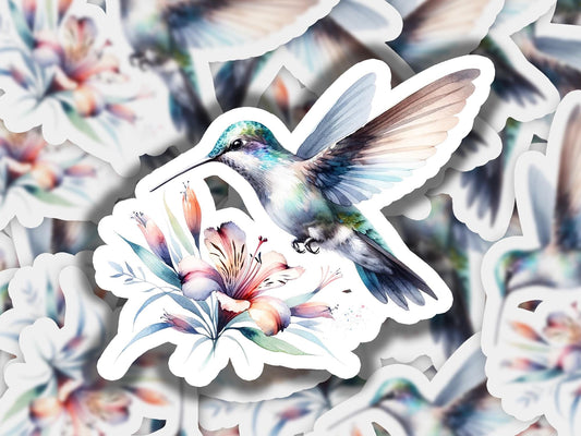 a sticker of a hummingbird flying over a flower