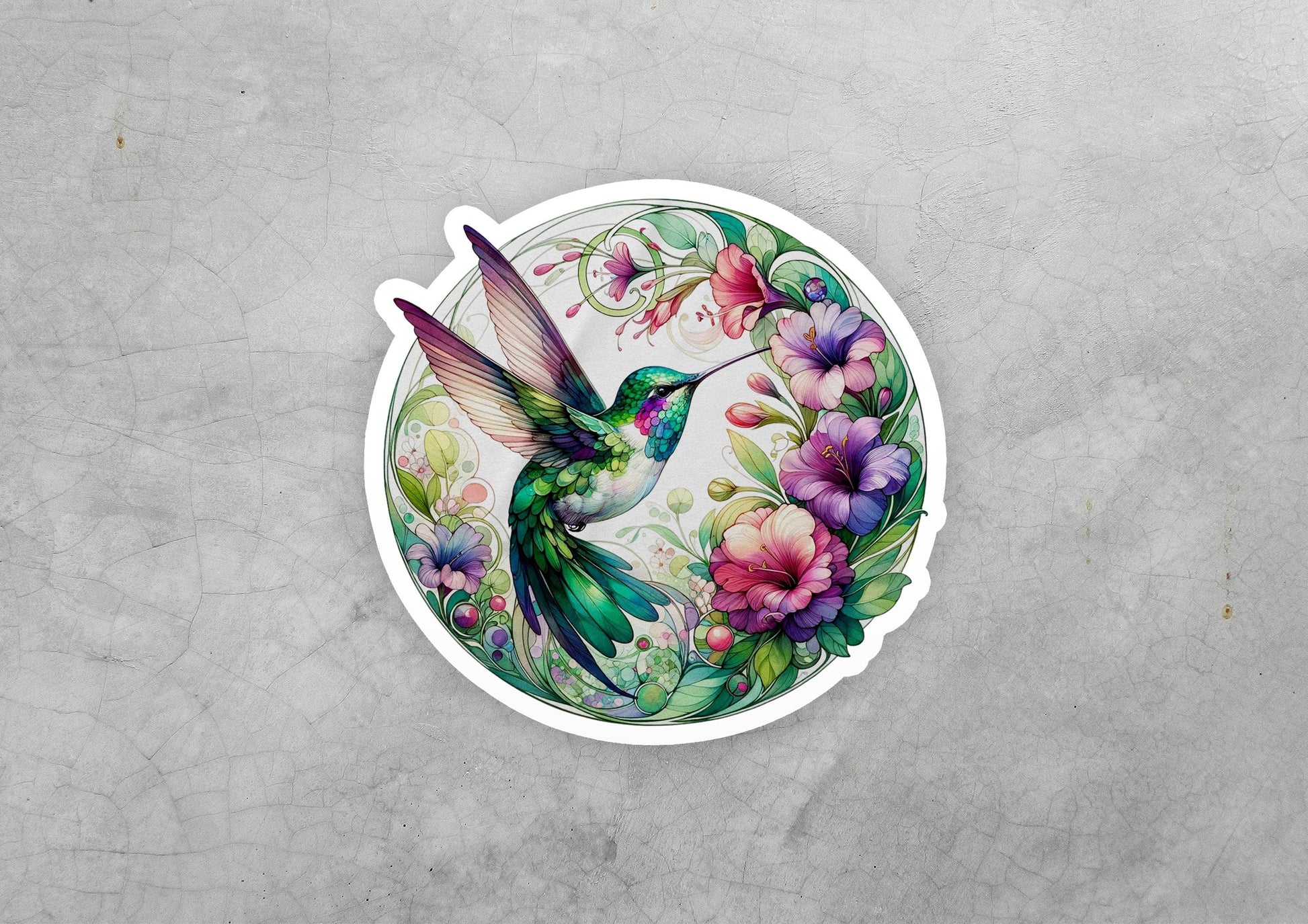 a sticker with a hummingbird and flowers on it