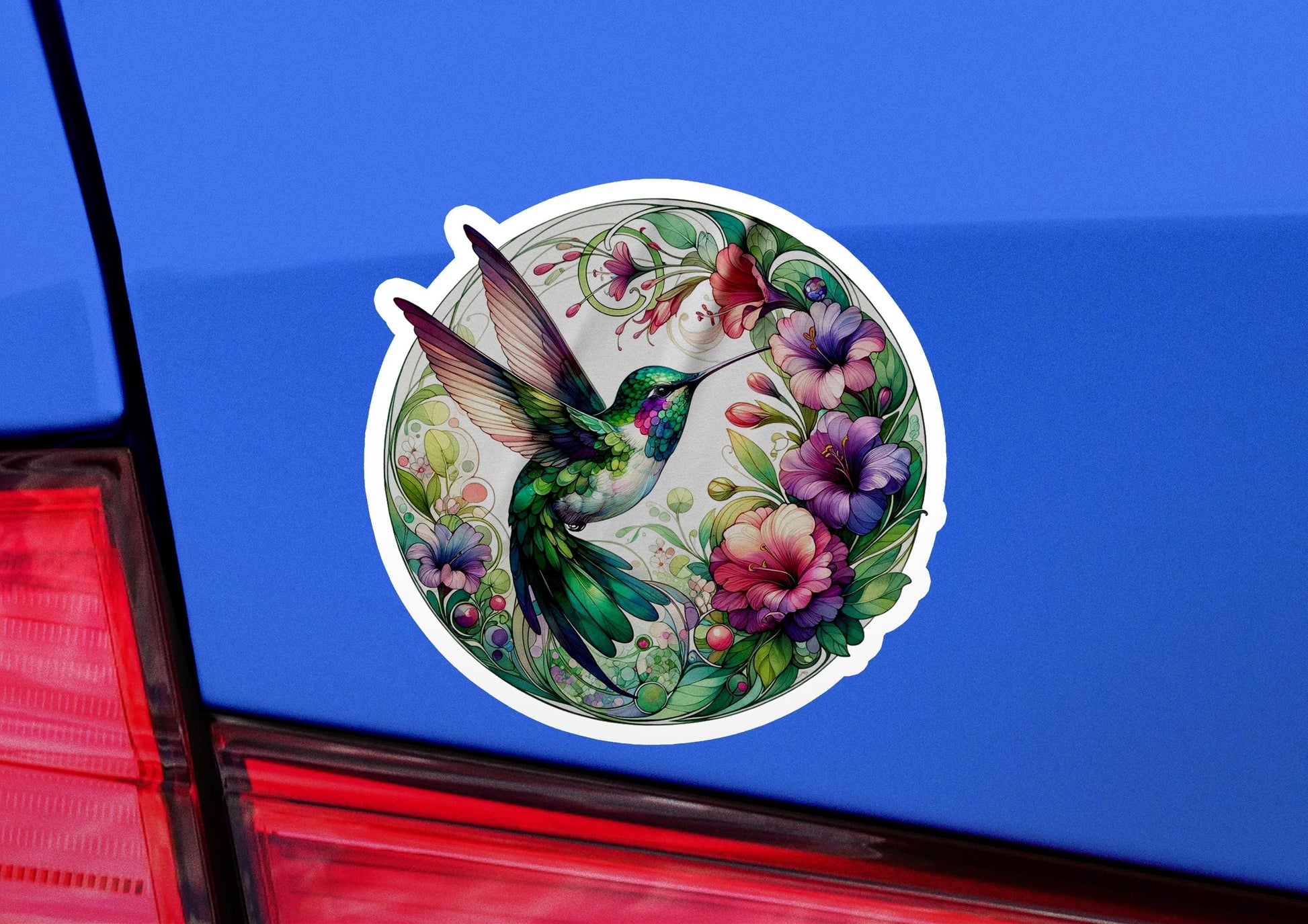 a sticker of a hummingbird with flowers on it