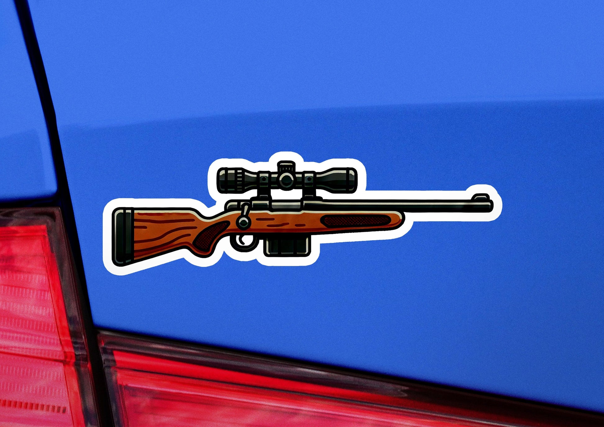 a blue car with a sticker of a rifle on it