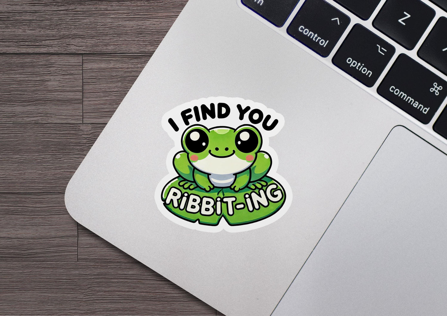 a laptop with a sticker that says i find you ribbit - ing