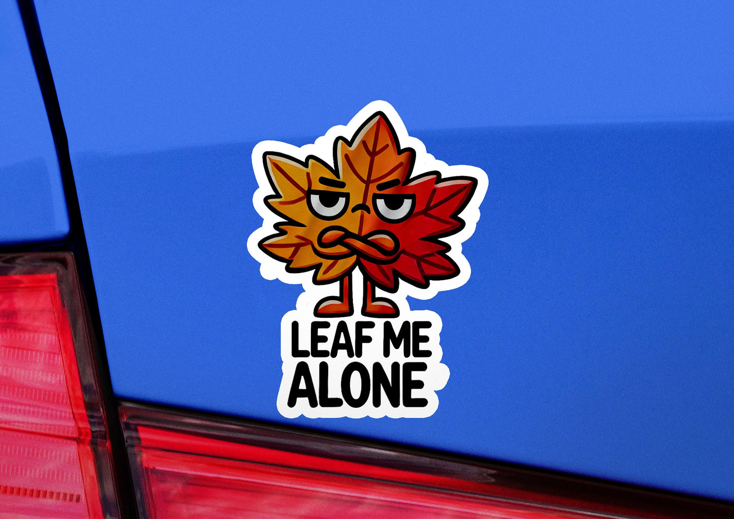 a leaf me alone sticker on the back of a car