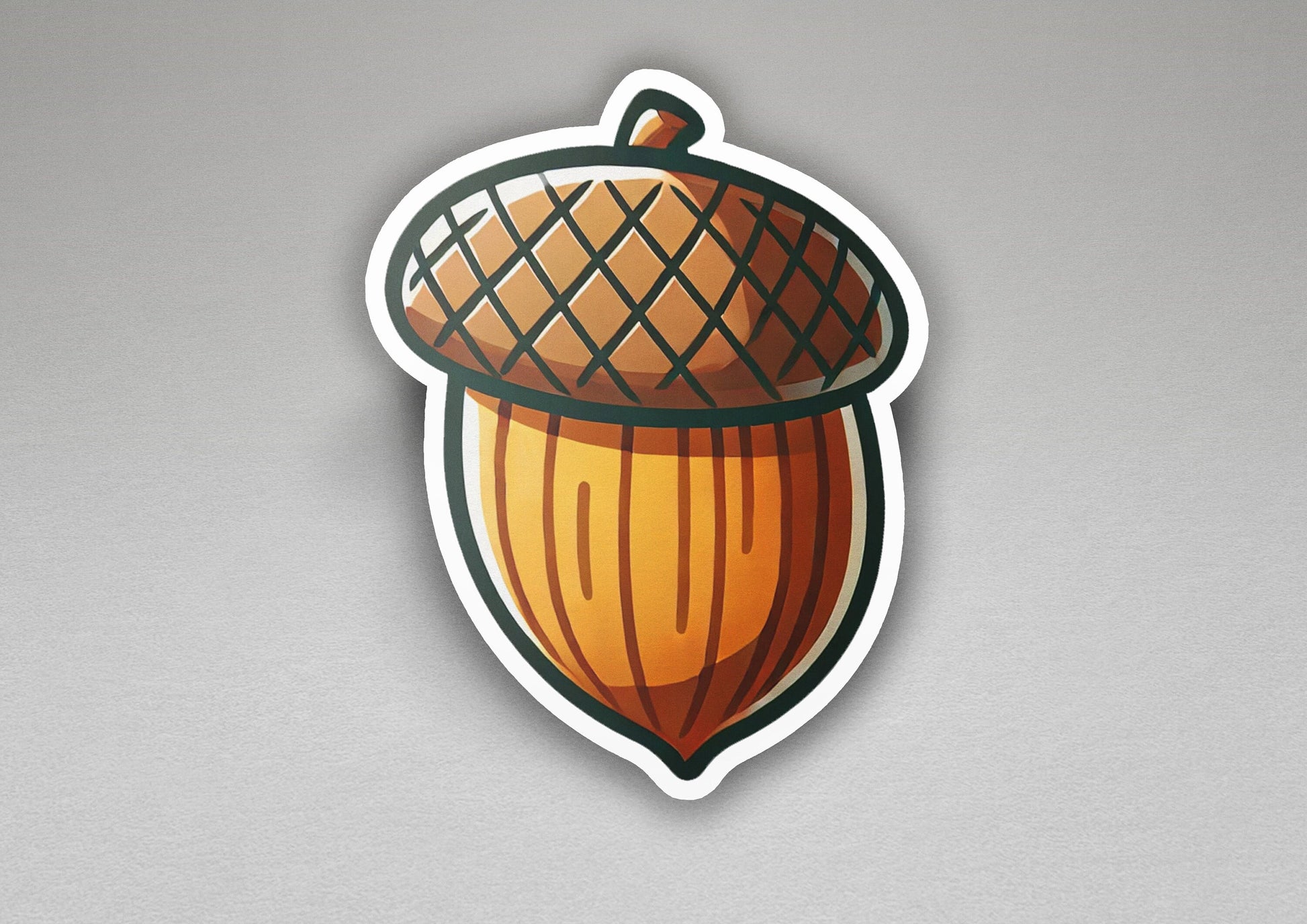 a sticker of an acorn on a gray background