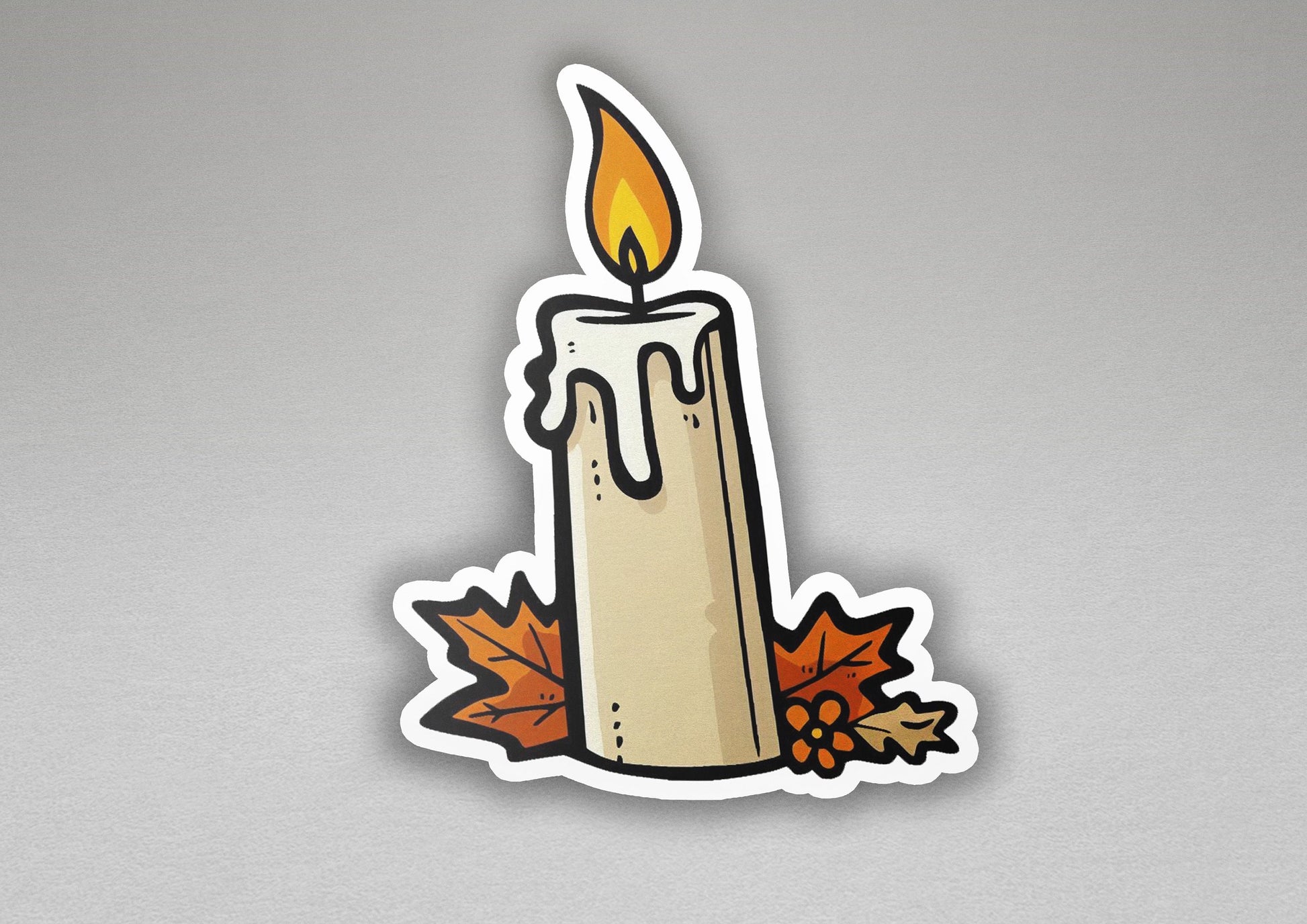 a sticker of a lit candle with autumn leaves