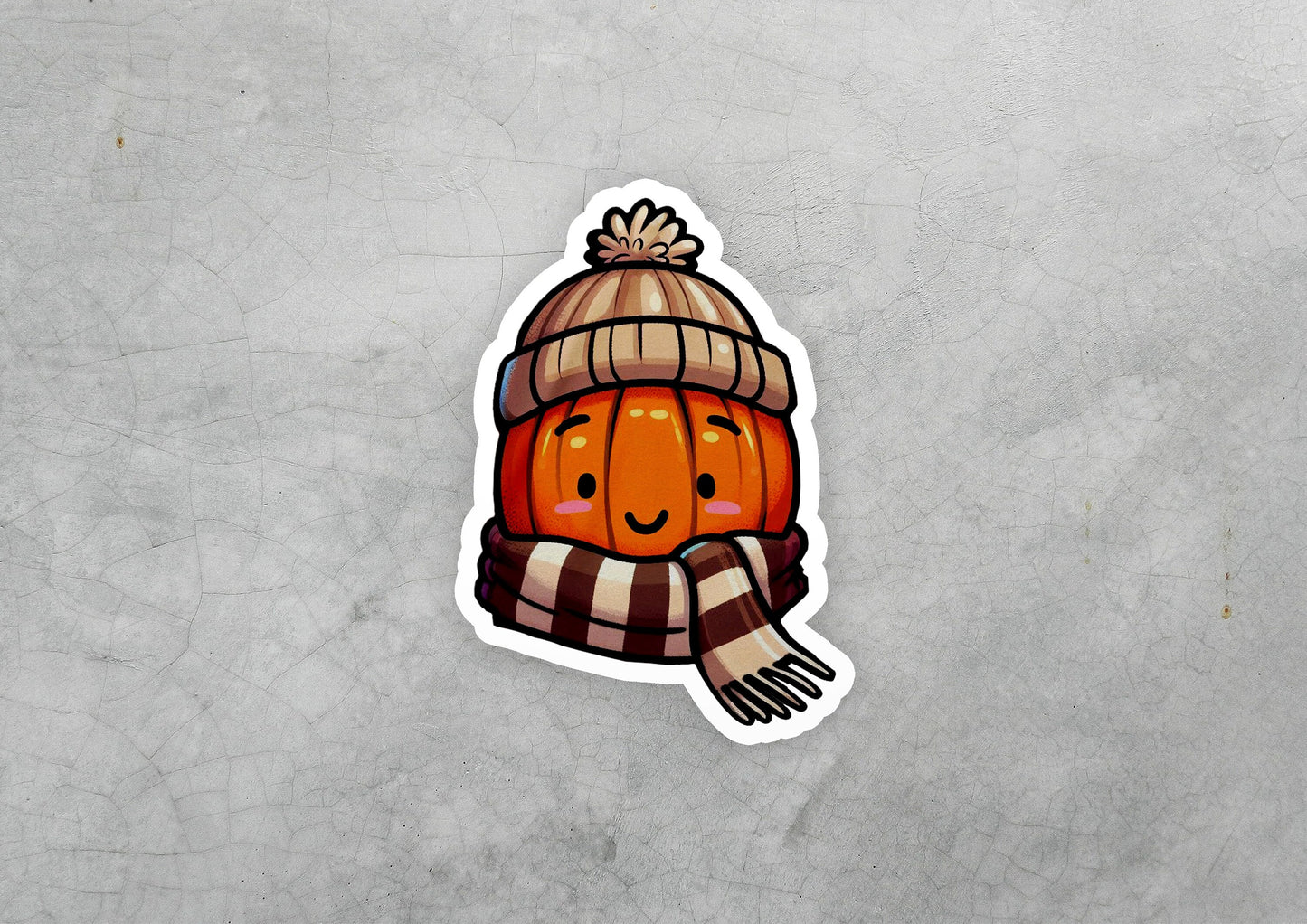 a sticker of a pumpkin wearing a hat and scarf