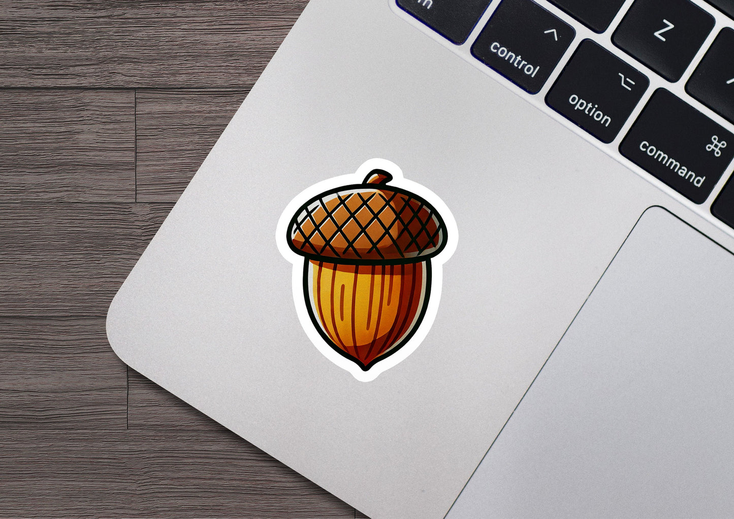 a laptop with a sticker of an acorn on it