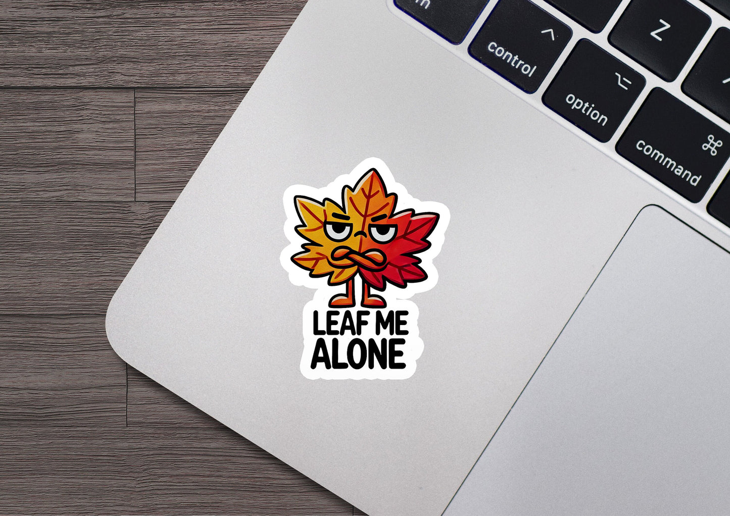 a laptop with a sticker that says leave me alone