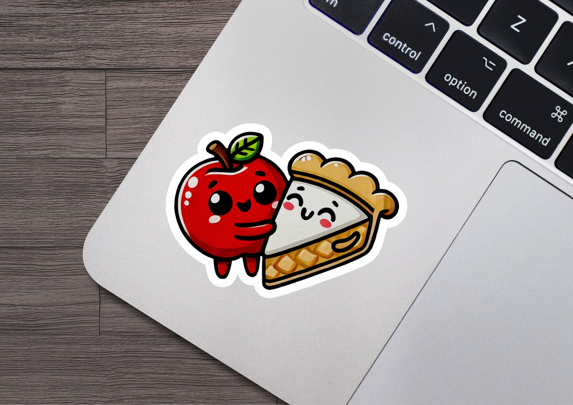 a laptop with a sticker of an apple and a piece of pie on it