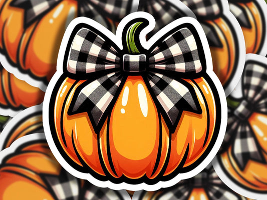 a sticker of a pumpkin with a bow on it