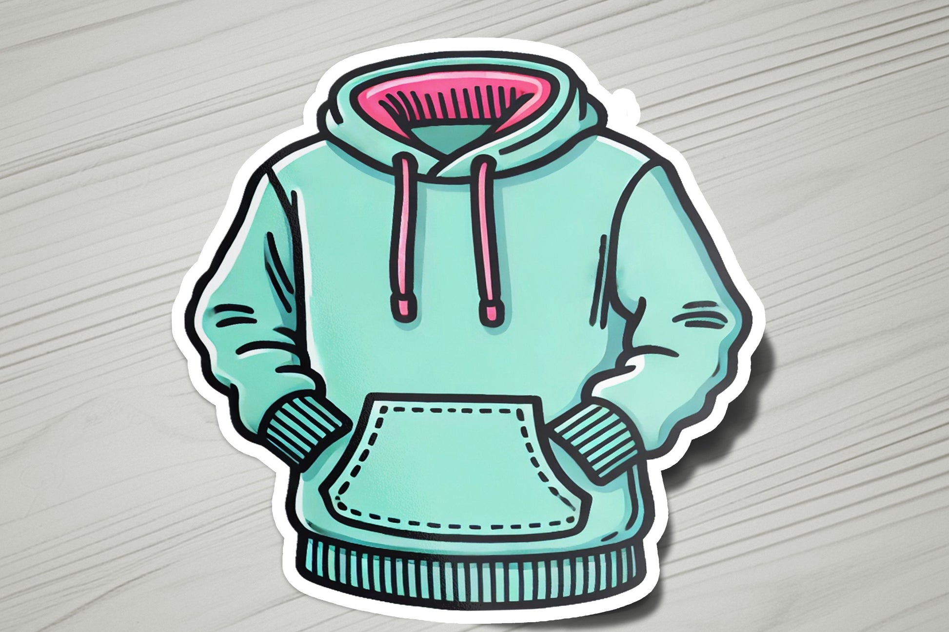 a sticker of a hoodie on a table