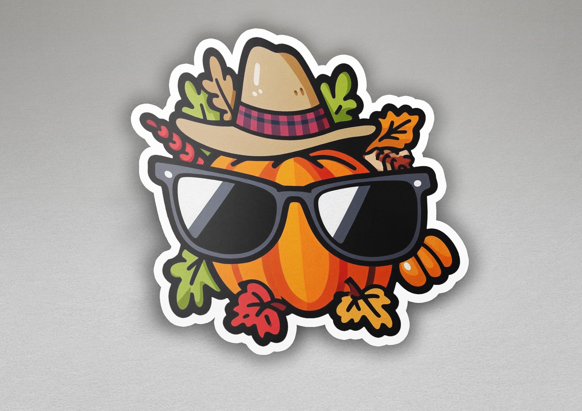 a sticker of a pumpkin wearing sunglasses and a hat