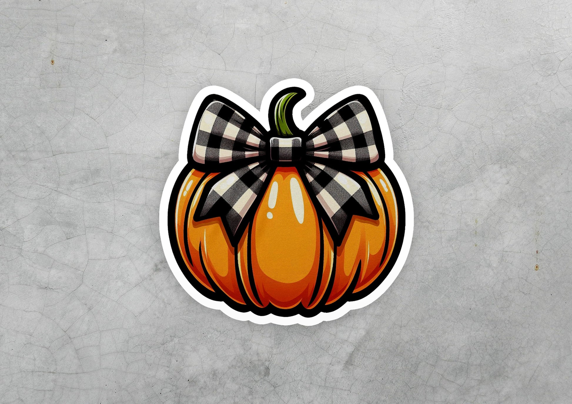 a sticker of a pumpkin with a bow