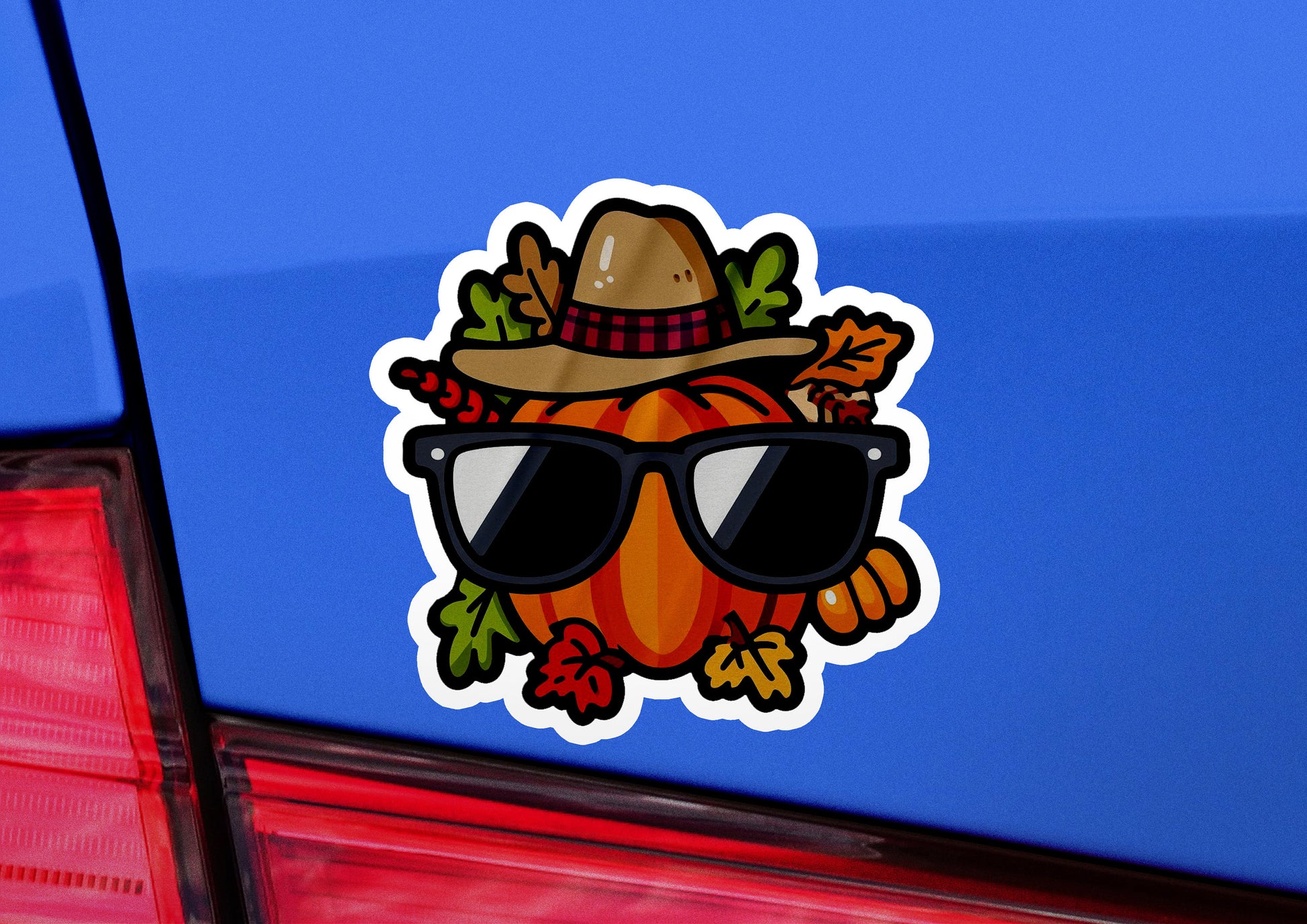 a car with a sticker of a hat and sunglasses