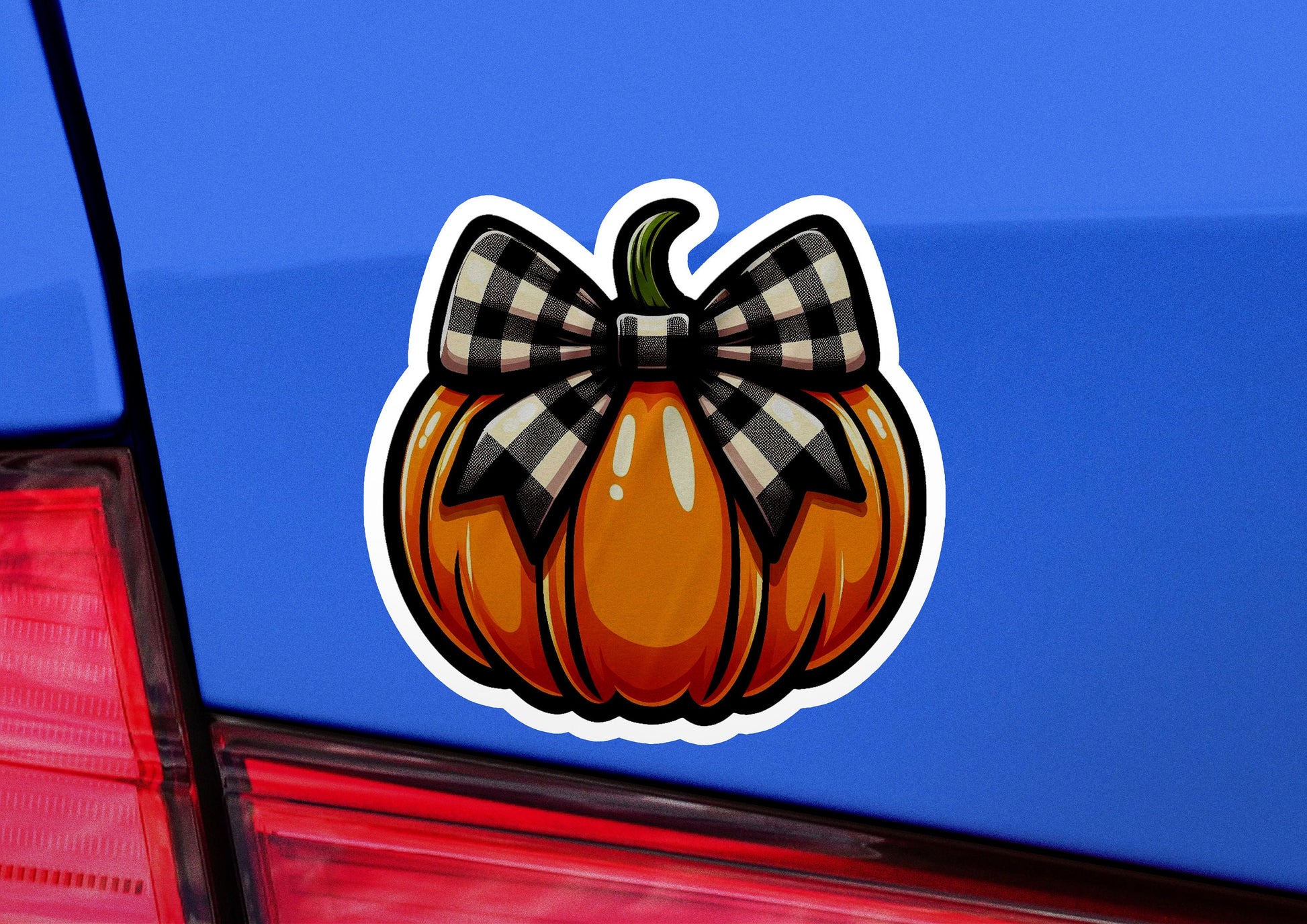 a sticker of a pumpkin with a bow on it