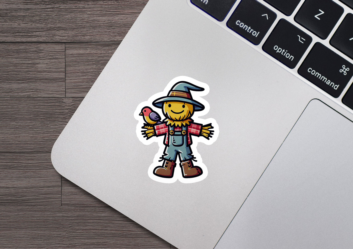 a sticker of a scarecrow holding a bird