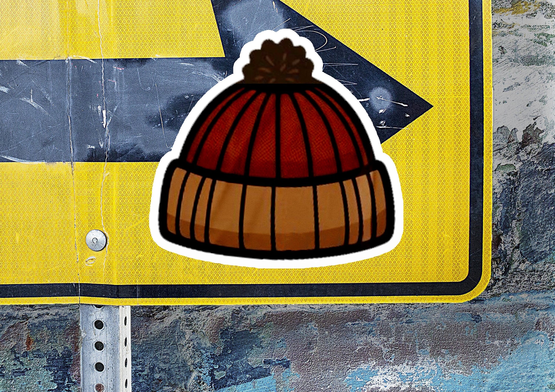 a sticker of a beanie on a street sign