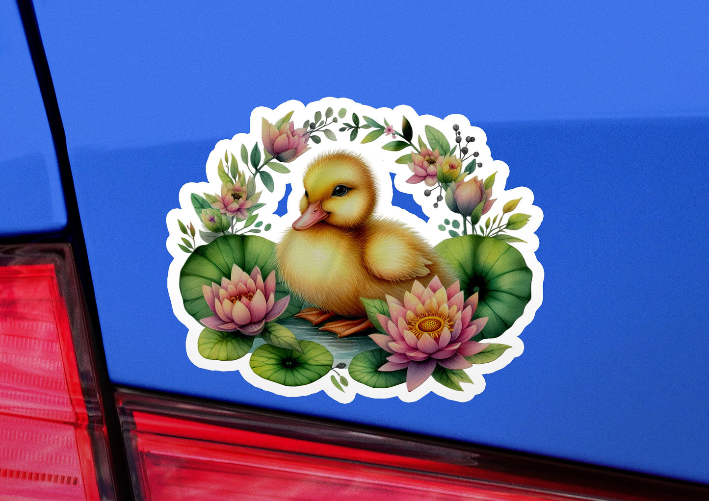 a sticker of a duckling on a blue car