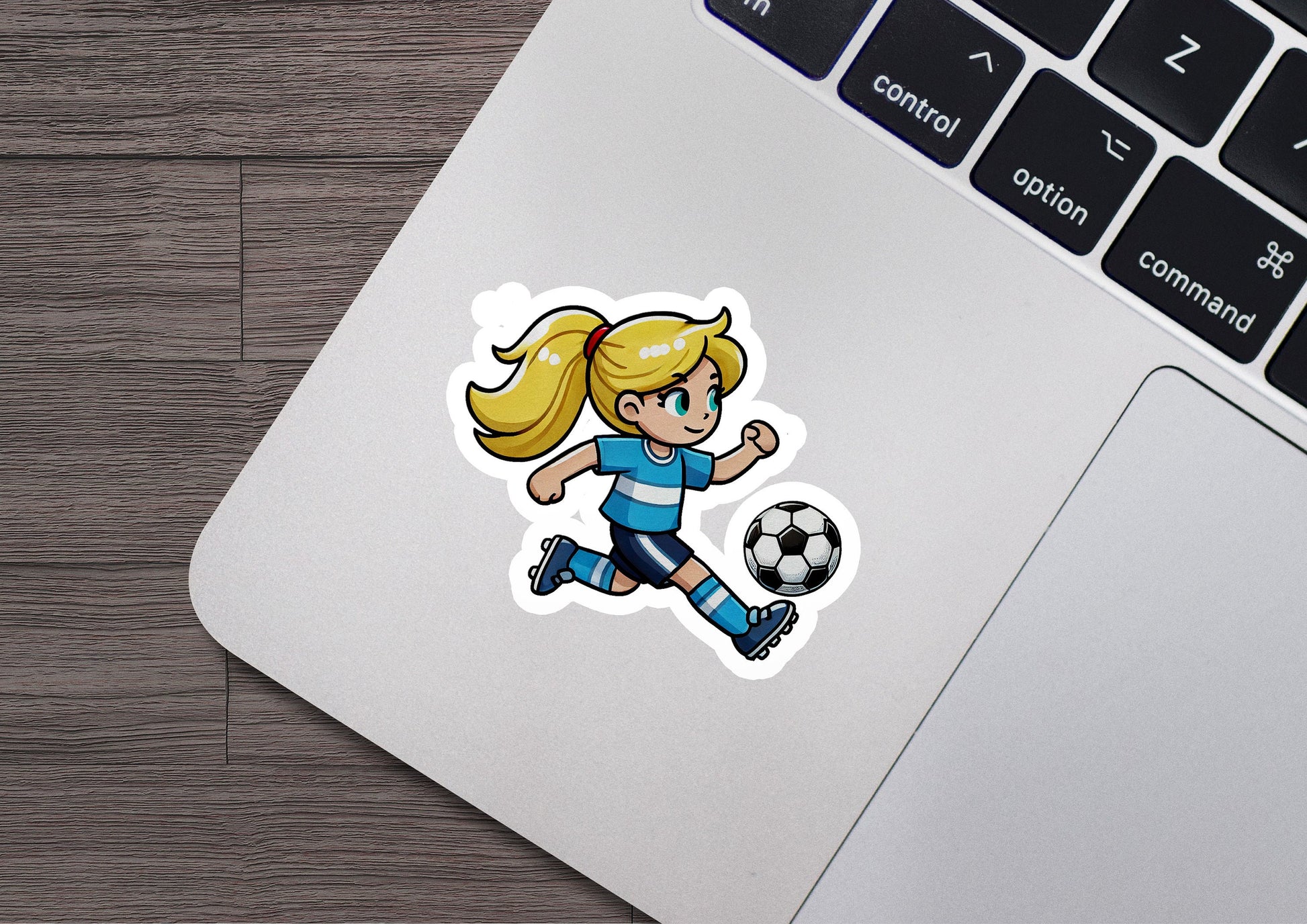 a sticker of a girl kicking a soccer ball