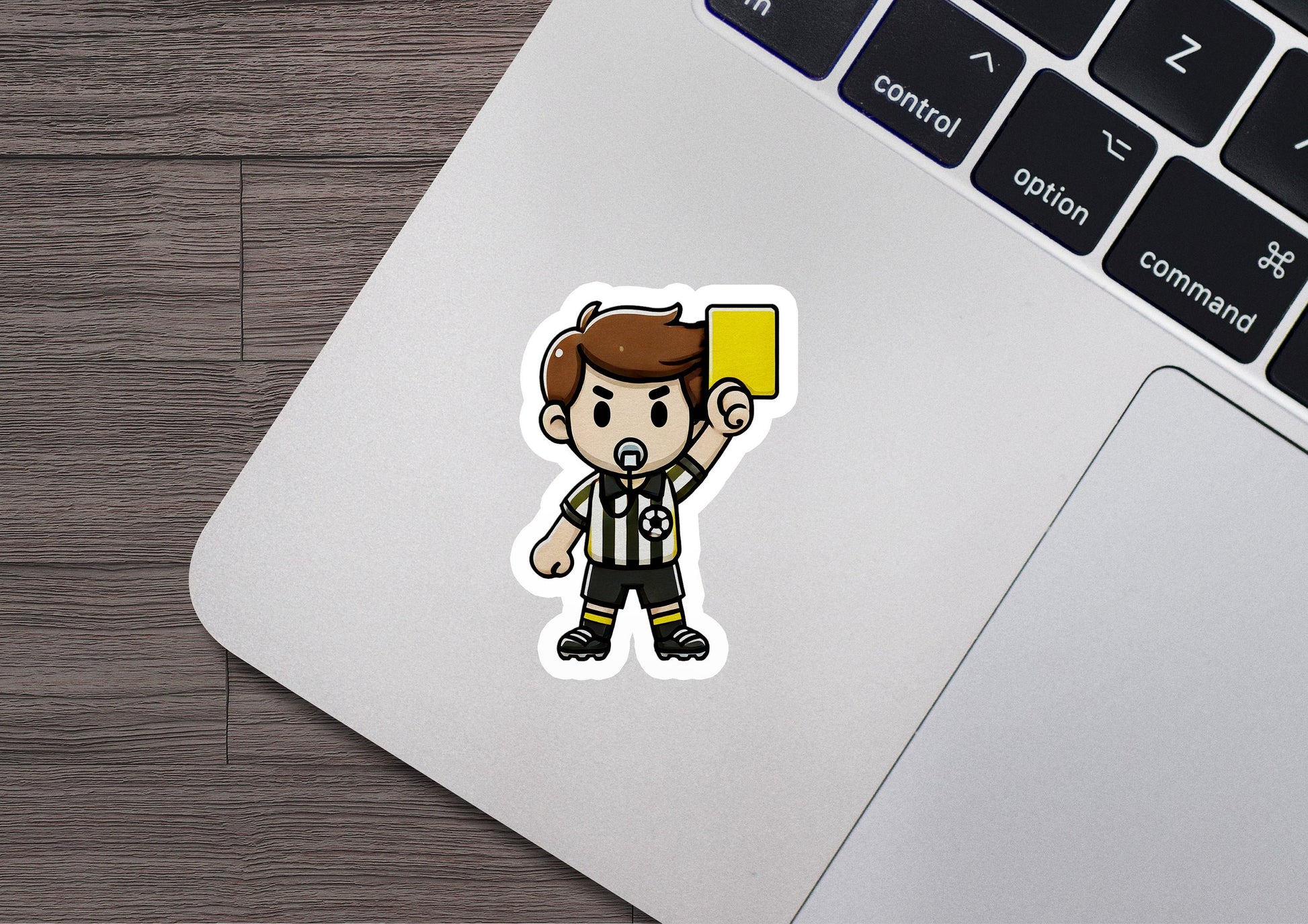 a laptop with a sticker of a soccer player