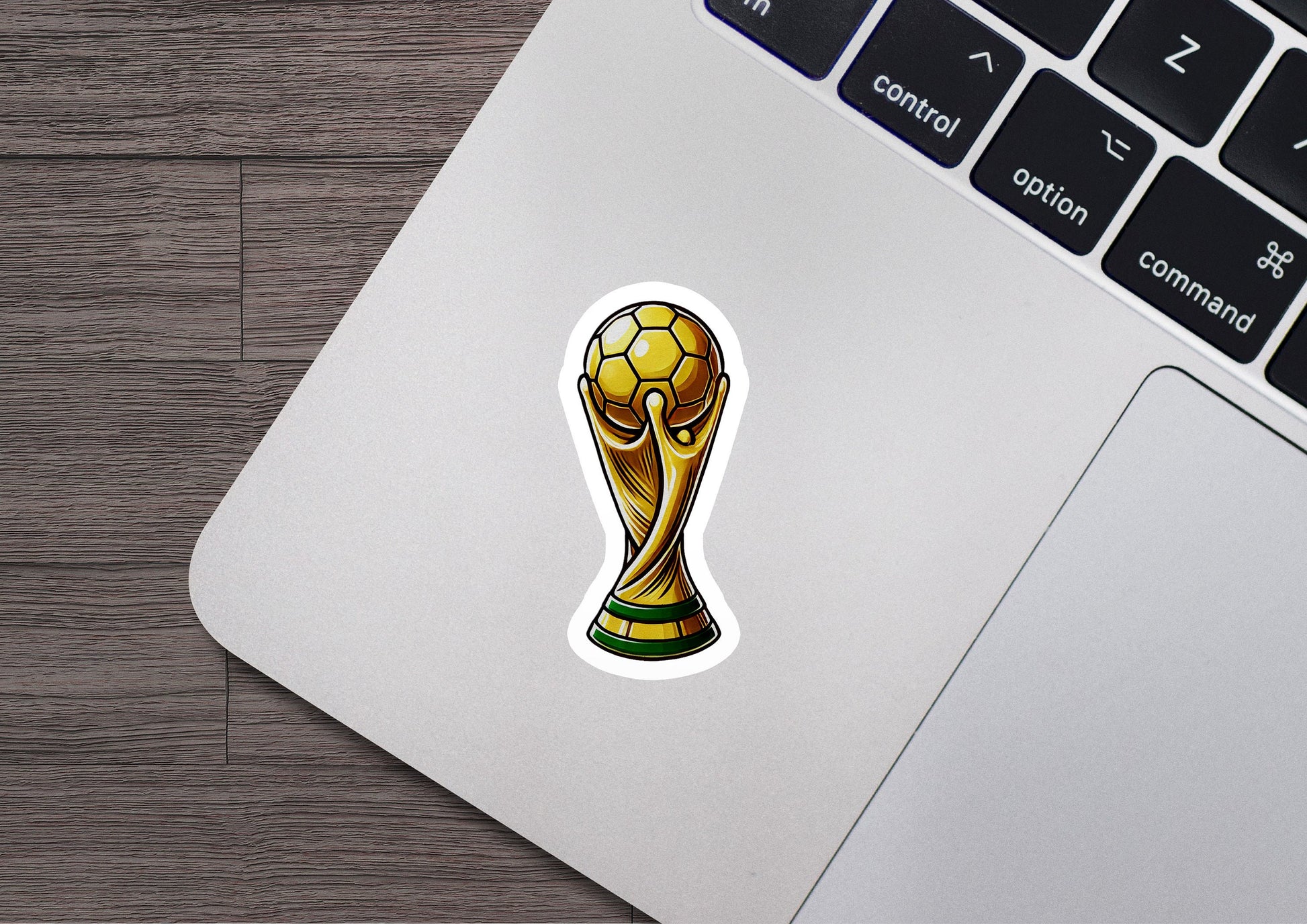 a laptop with a sticker of a soccer ball on it