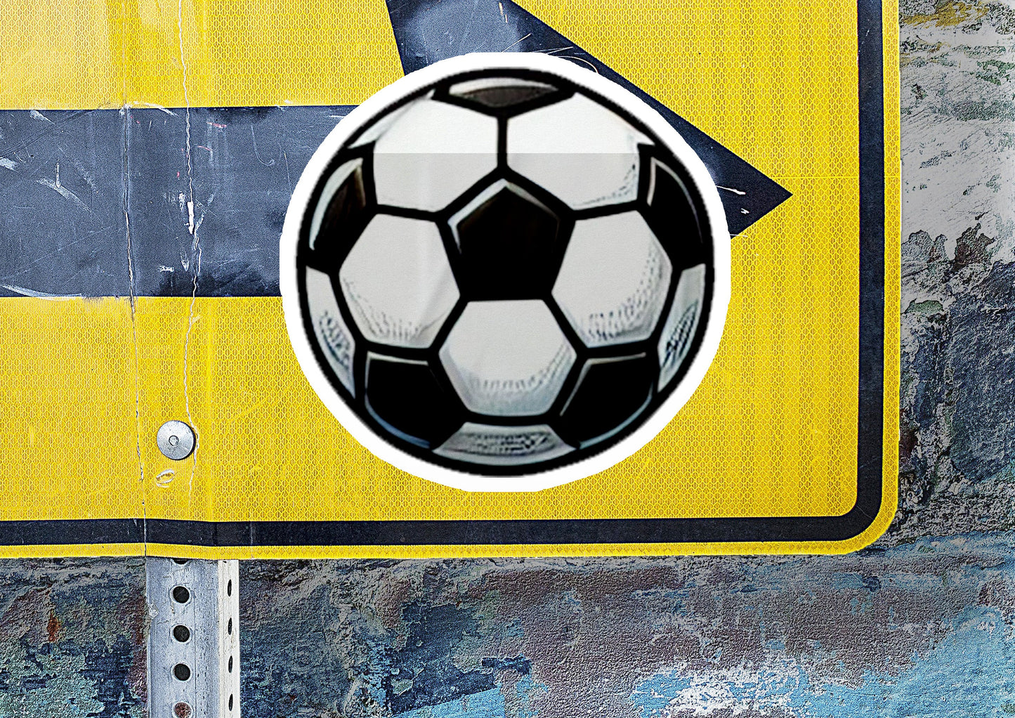 a yellow and black street sign with a soccer ball on it