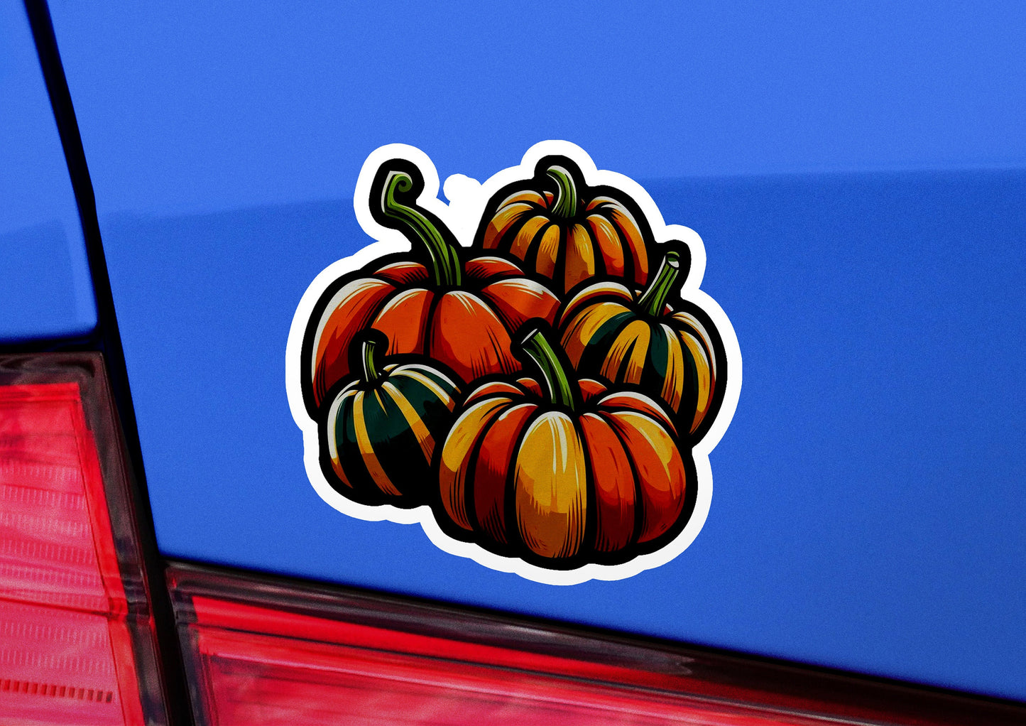 a blue car with a bunch of pumpkins on it