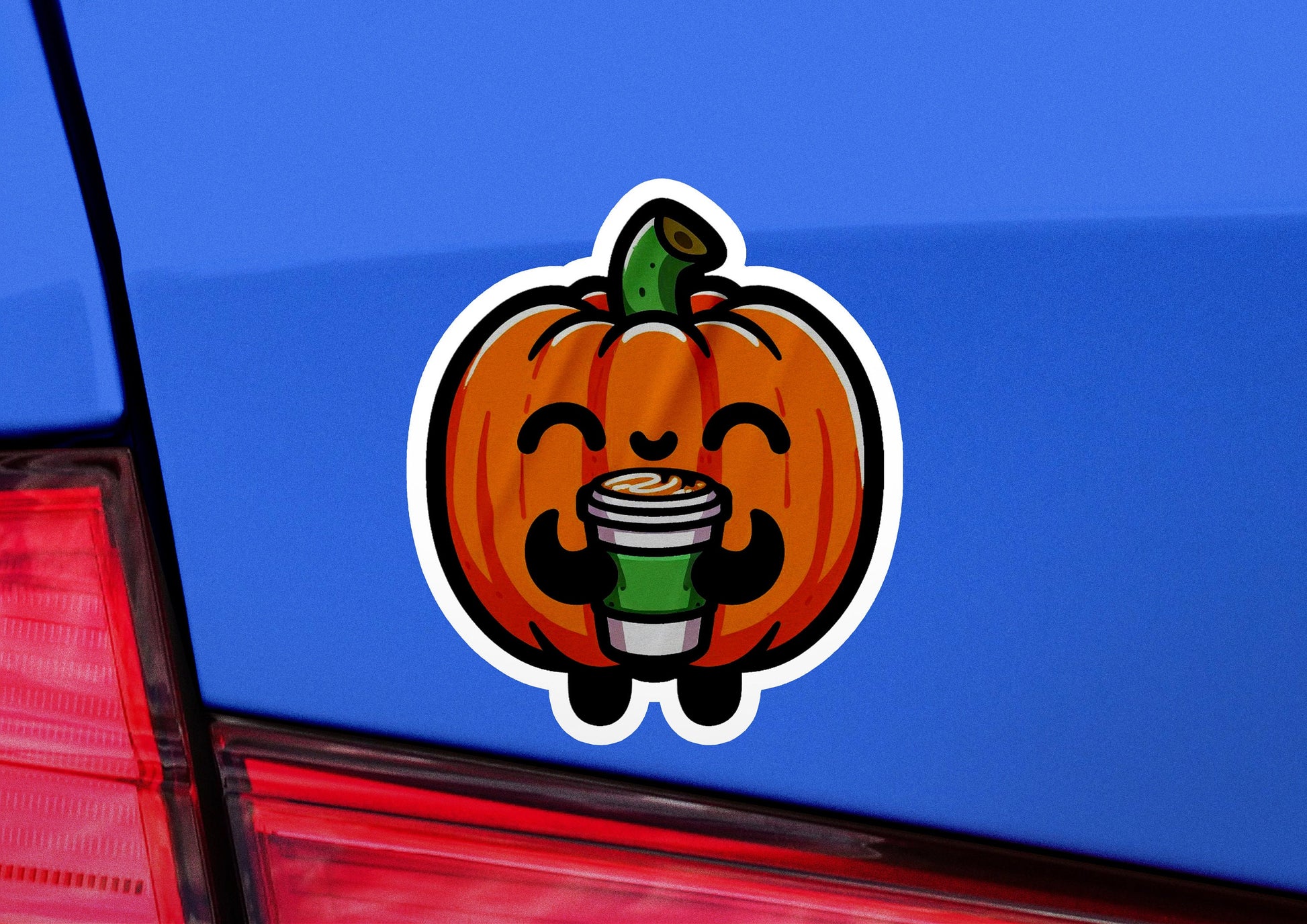 a sticker of a pumpkin holding a cup of coffee