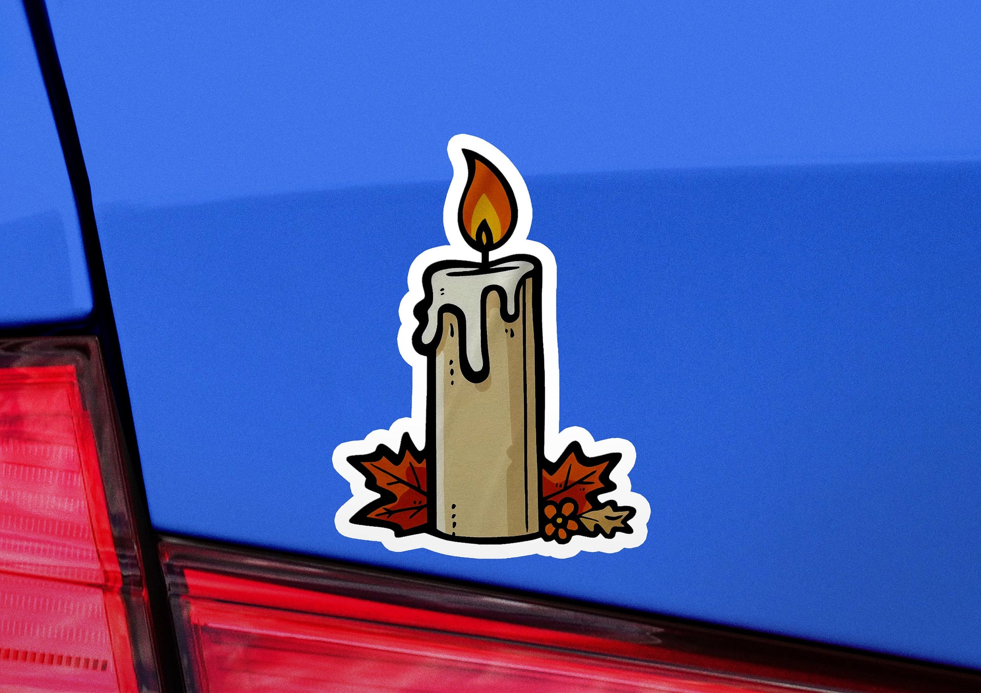 a candle sticker on the back of a car