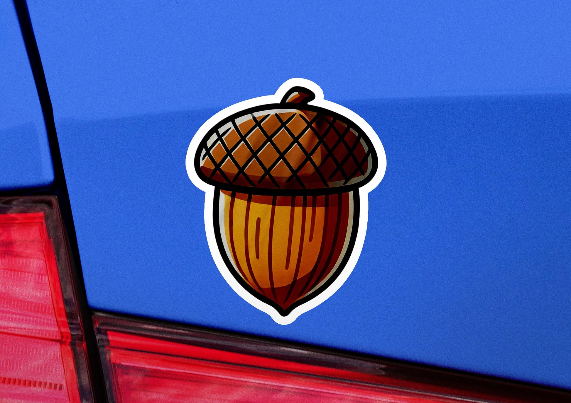 a sticker of an acorn on the back of a car