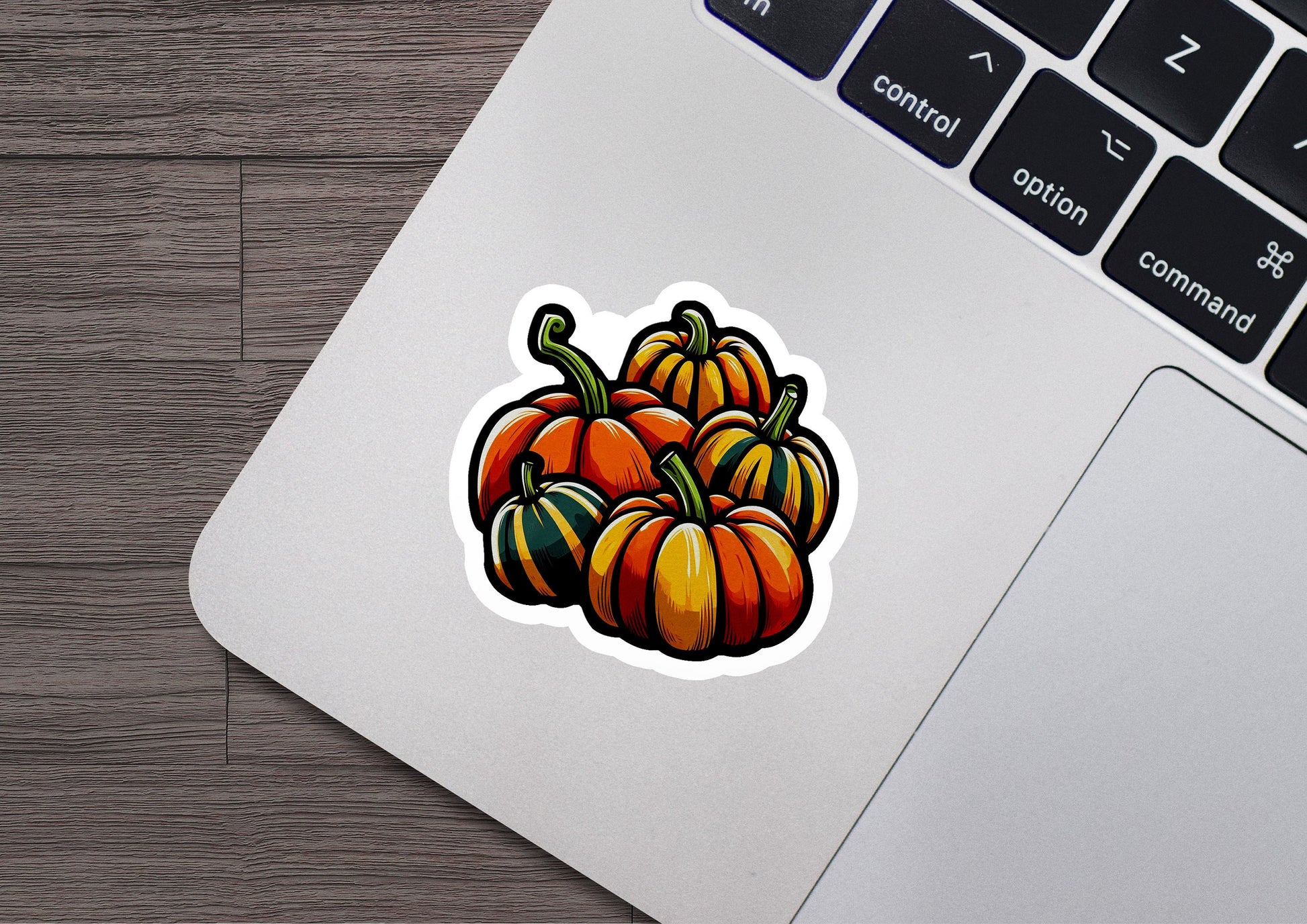 a sticker of a bunch of pumpkins on a laptop