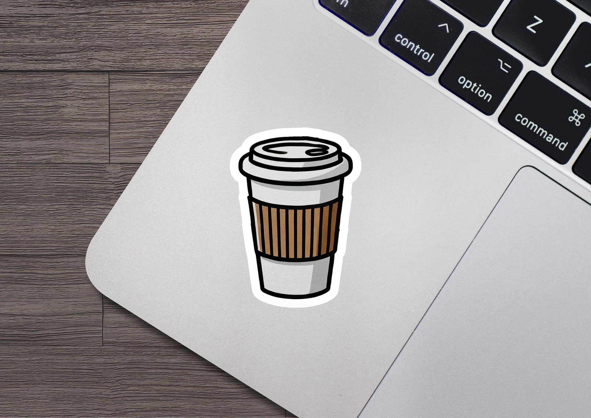 a laptop with a sticker of a coffee cup