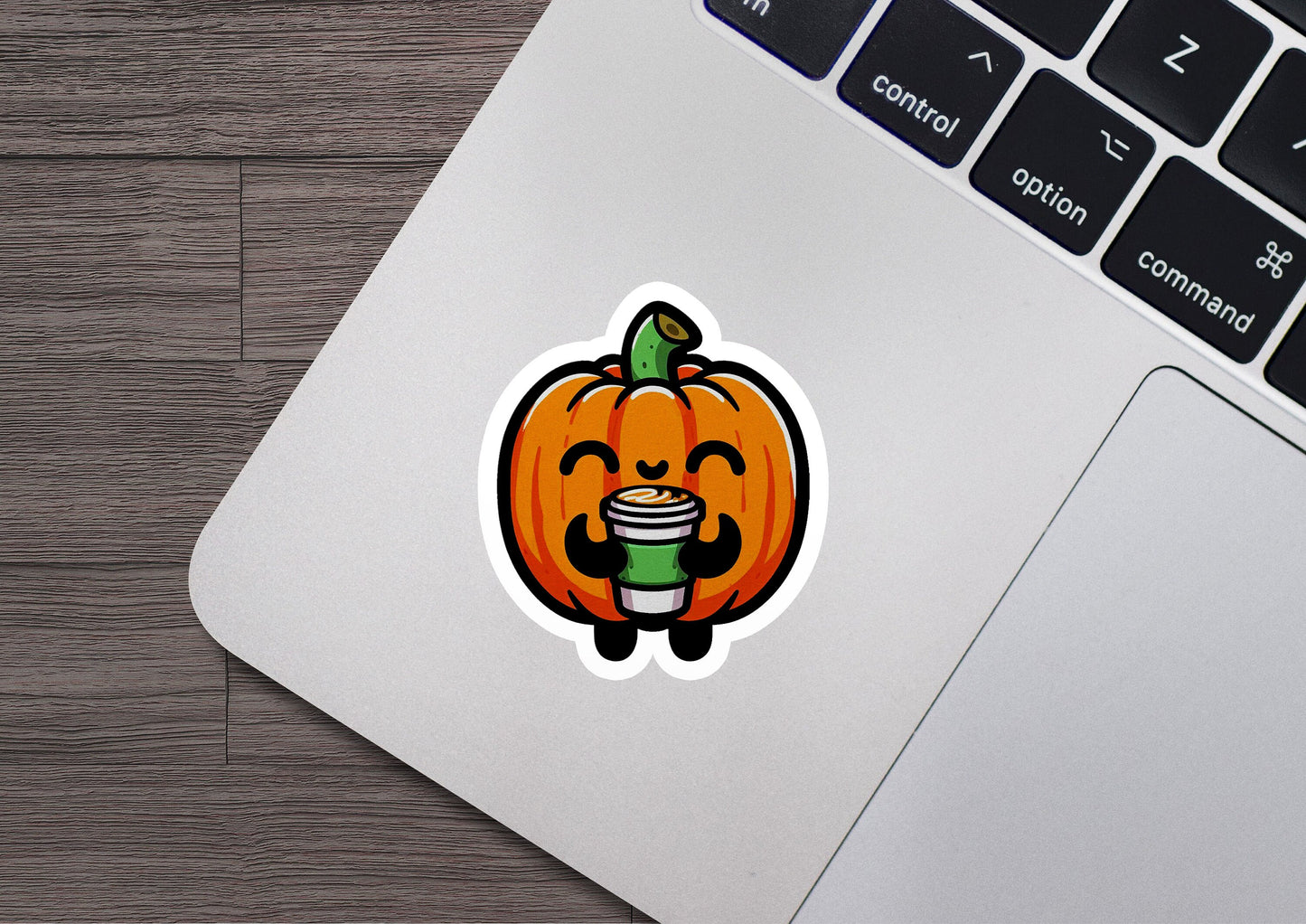 a laptop with a sticker of a pumpkin on it