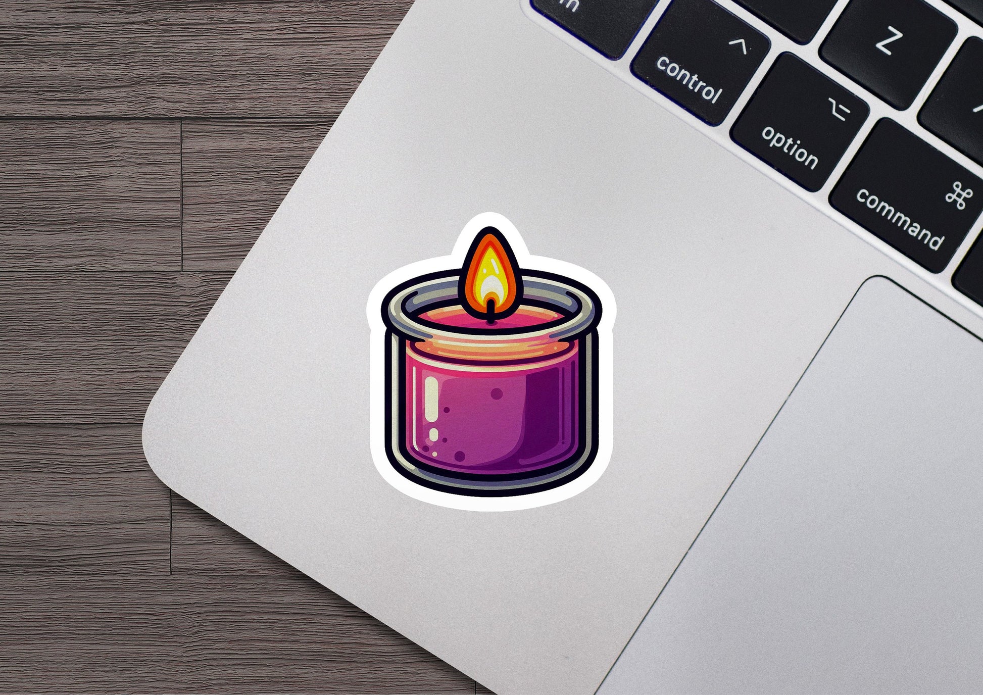 a sticker of a candle on a laptop