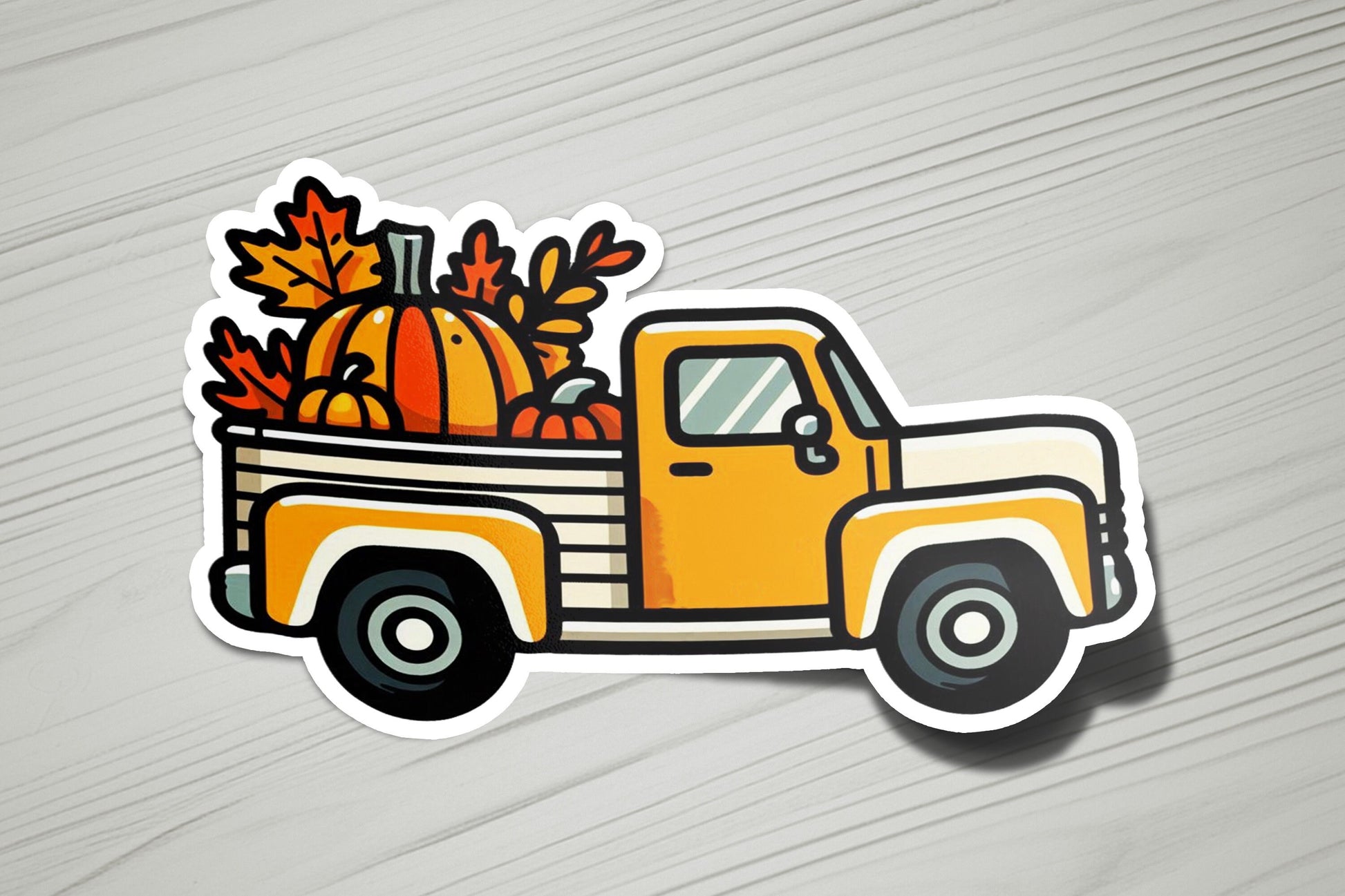 a sticker of a truck with pumpkins in the back