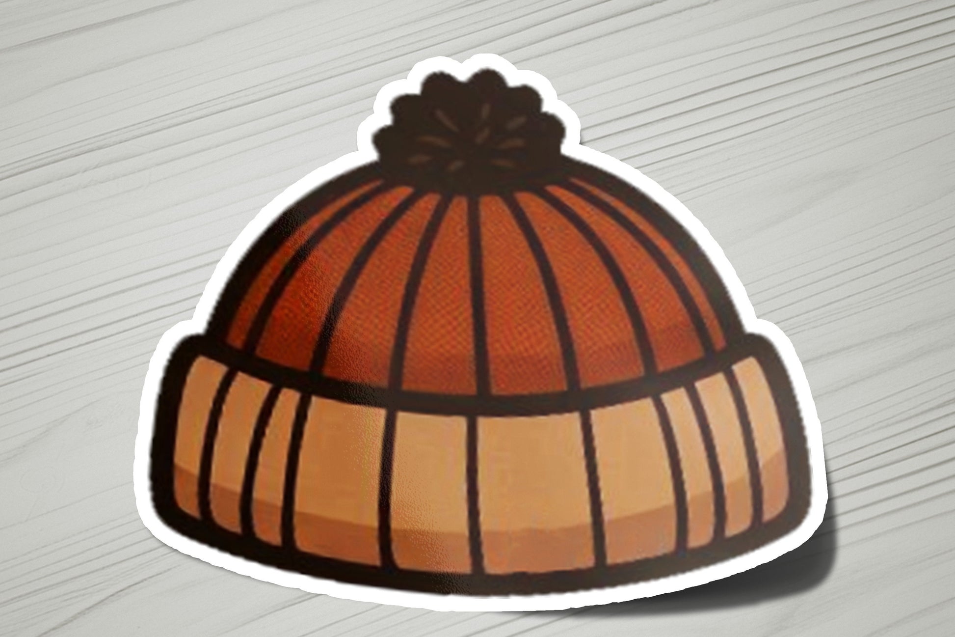 a sticker of a beanie on a table