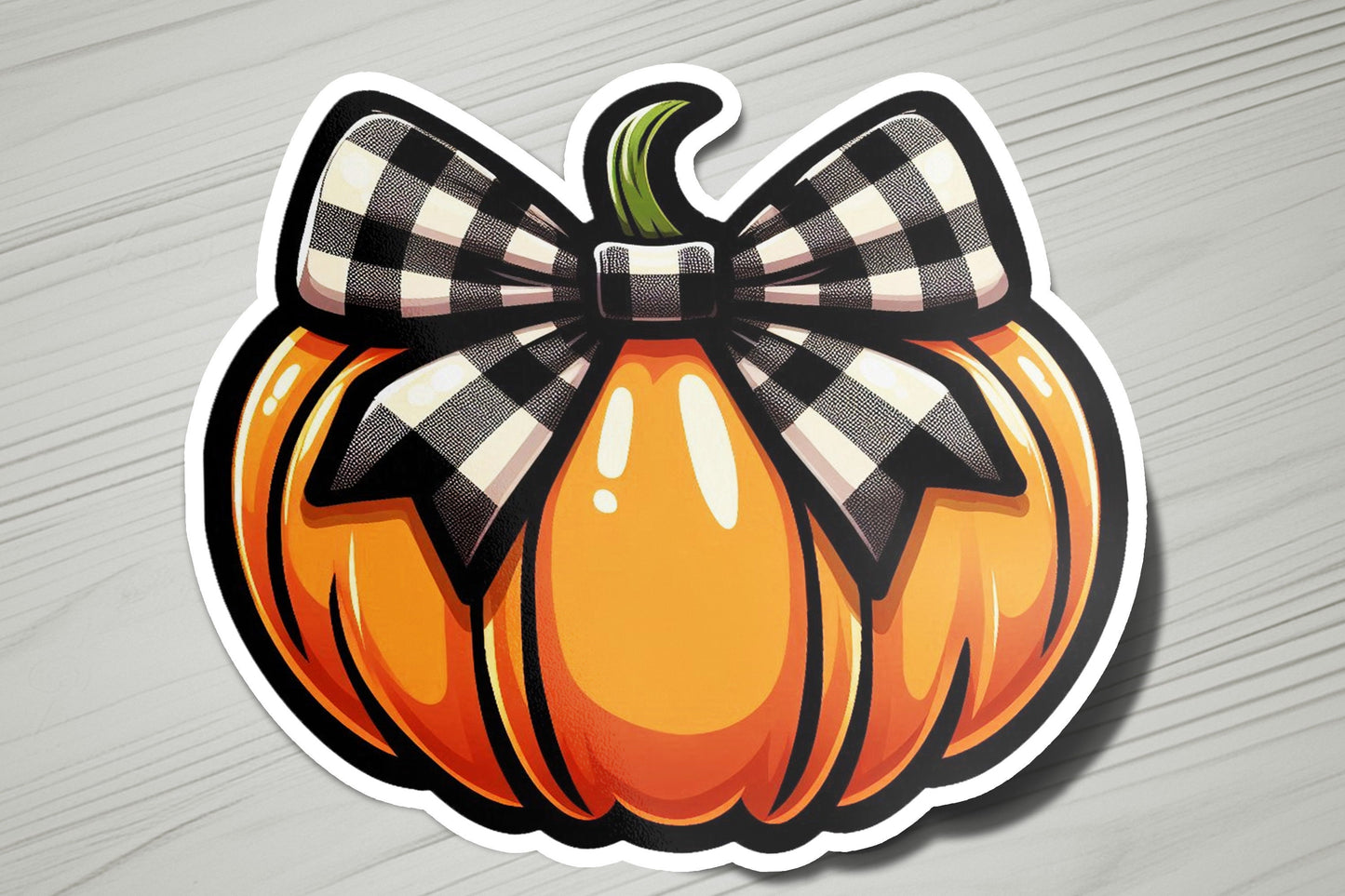 a sticker of a pumpkin with a bow