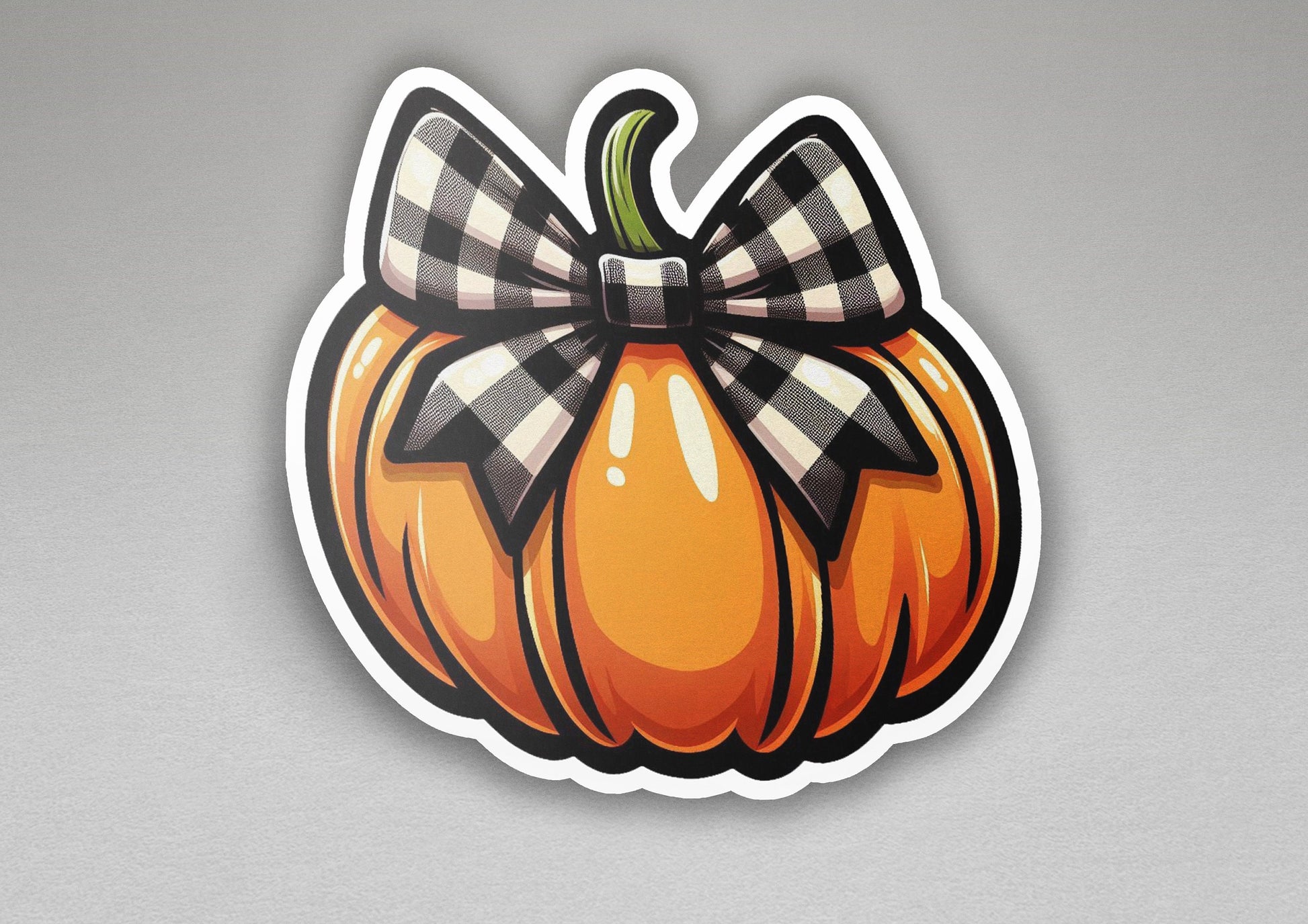 a sticker of a pumpkin with a bow