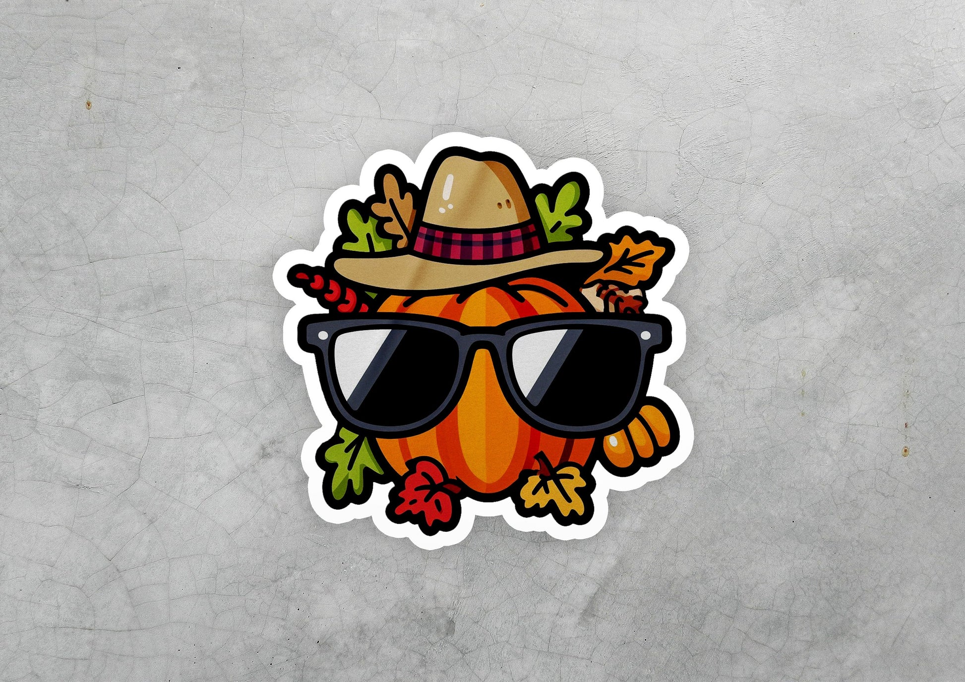 a sticker of a pumpkin wearing sunglasses and a hat