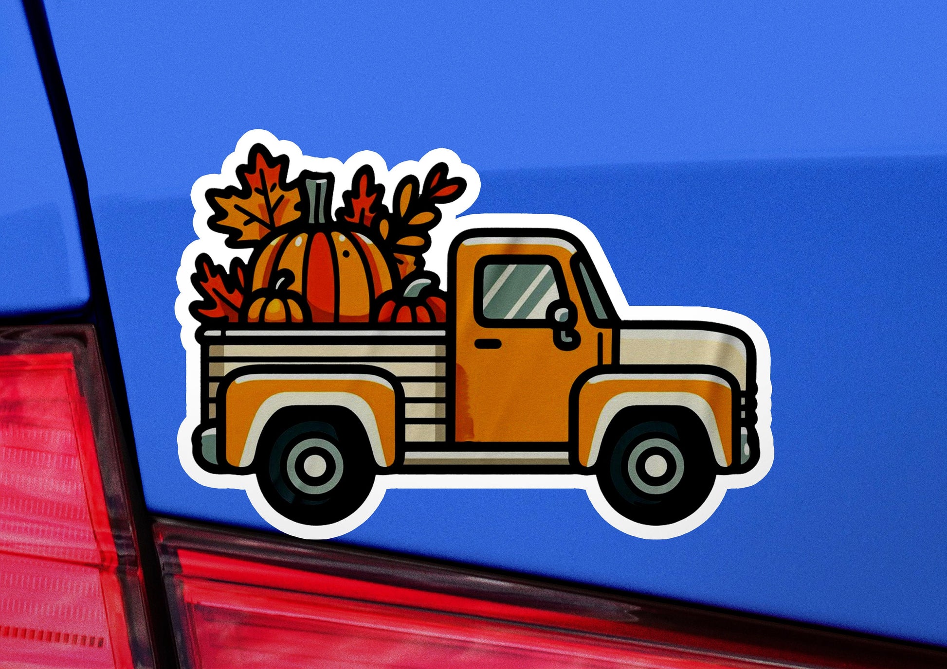 a sticker of a truck with a pumpkin in the back