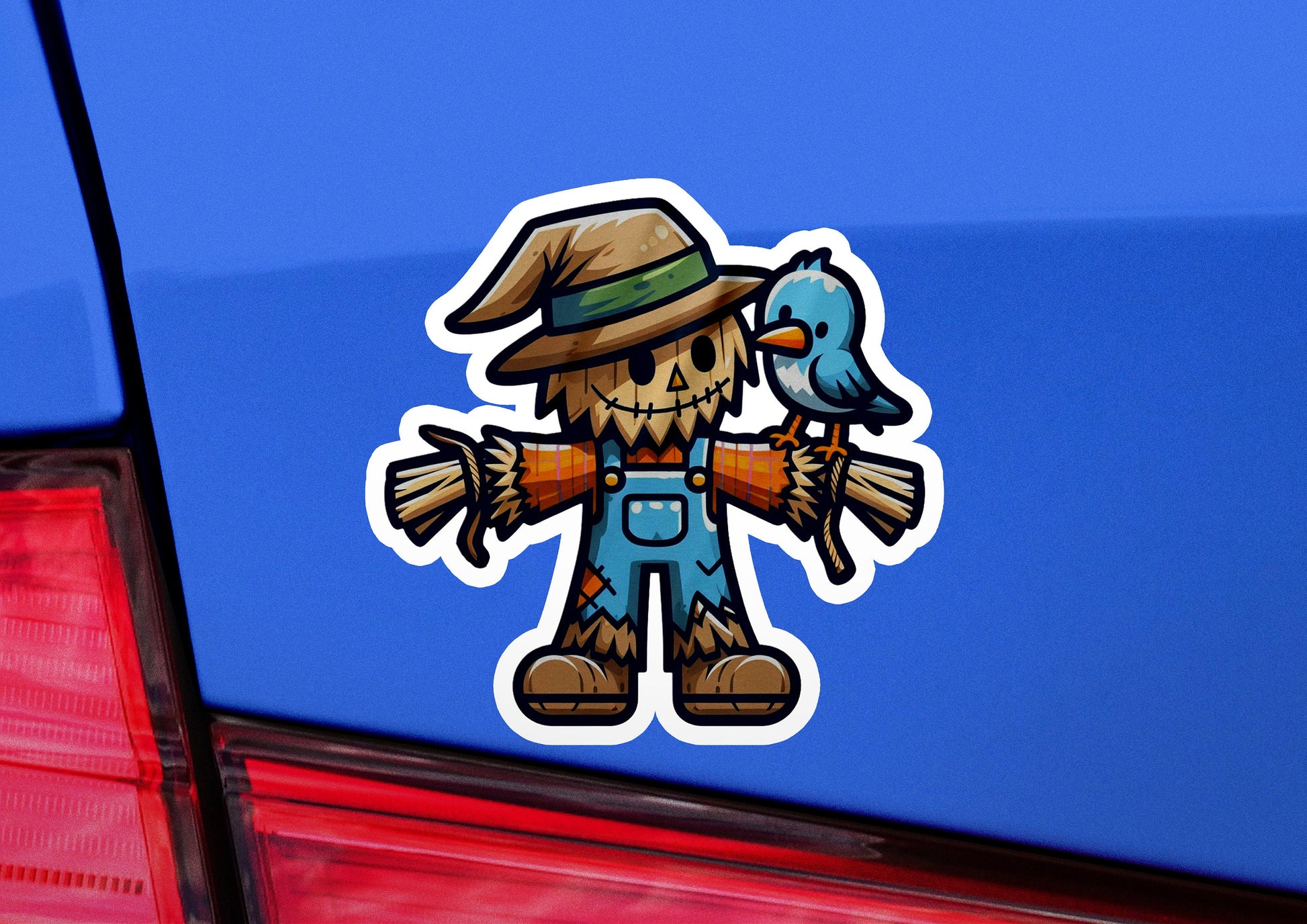 a sticker of a scarecrow holding a bird