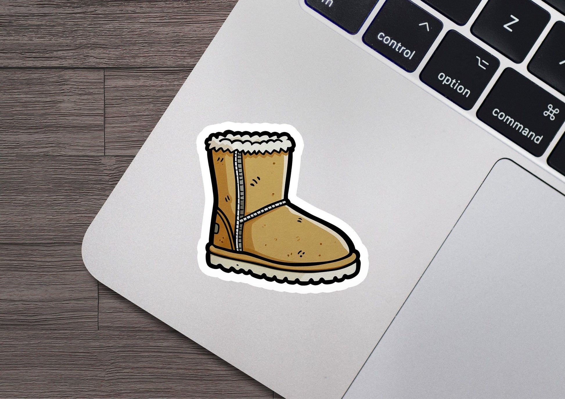 a sticker of a boot on a laptop keyboard