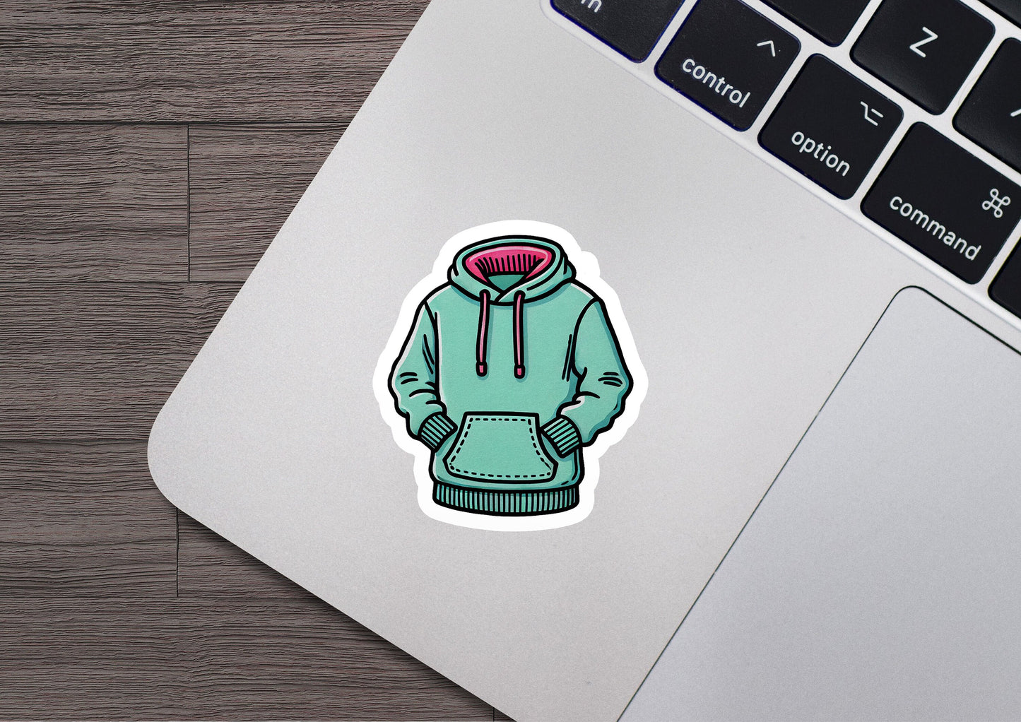 a laptop with a sticker of a hoodie on it