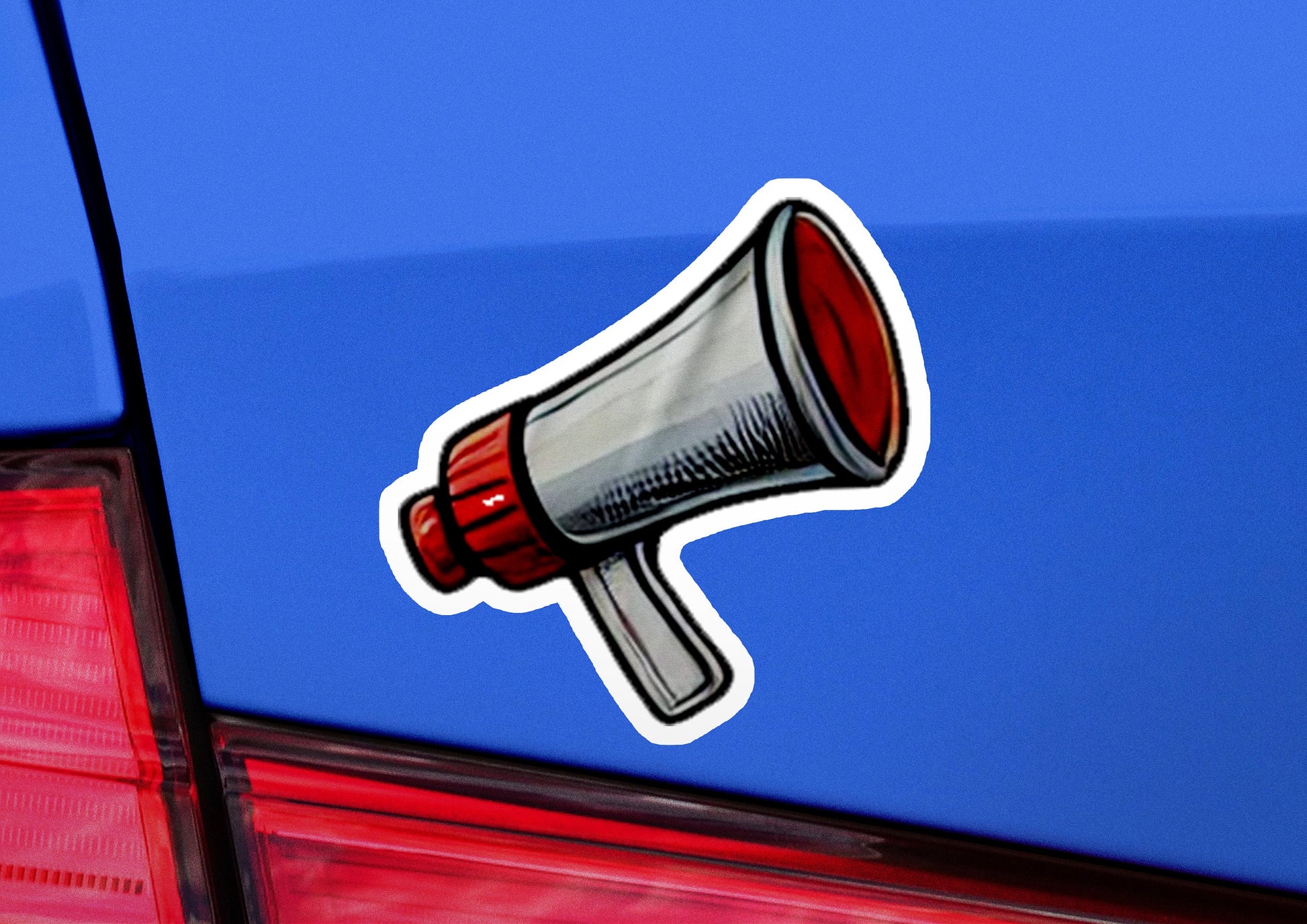 a sticker of a red and white megaphone on a blue car