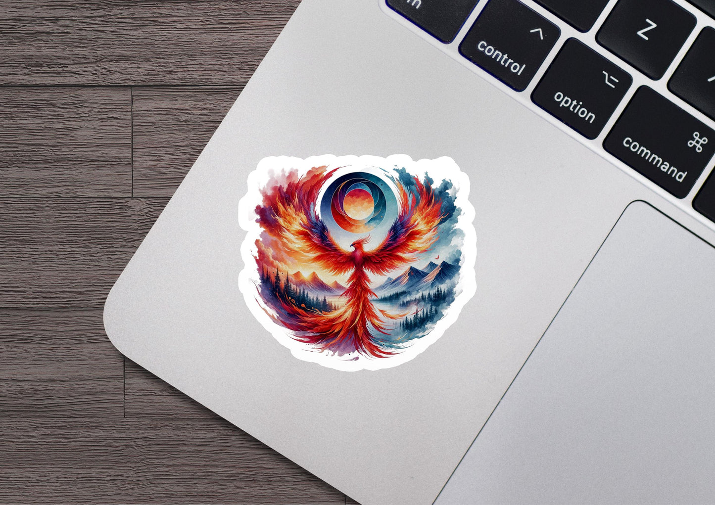 a laptop with a sticker of a bird on it