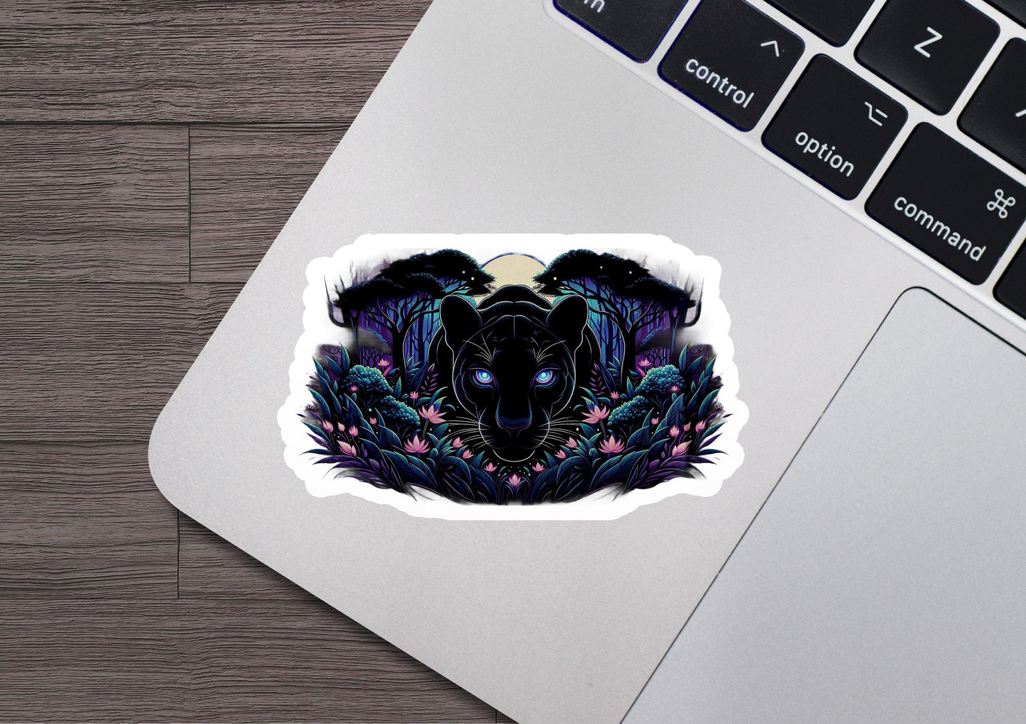 a laptop with a sticker of a panther on it