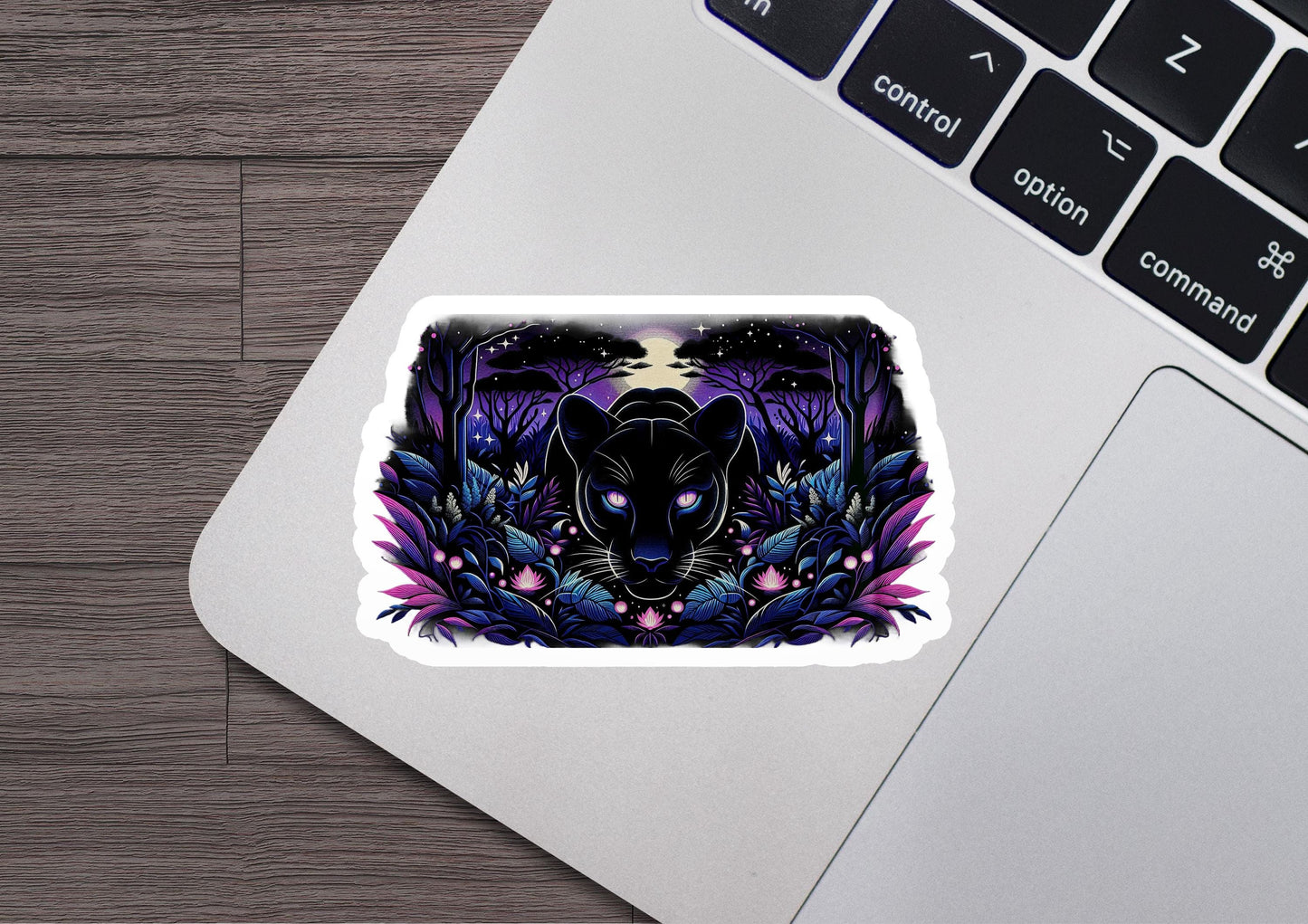 a laptop with a sticker of a wolf on it