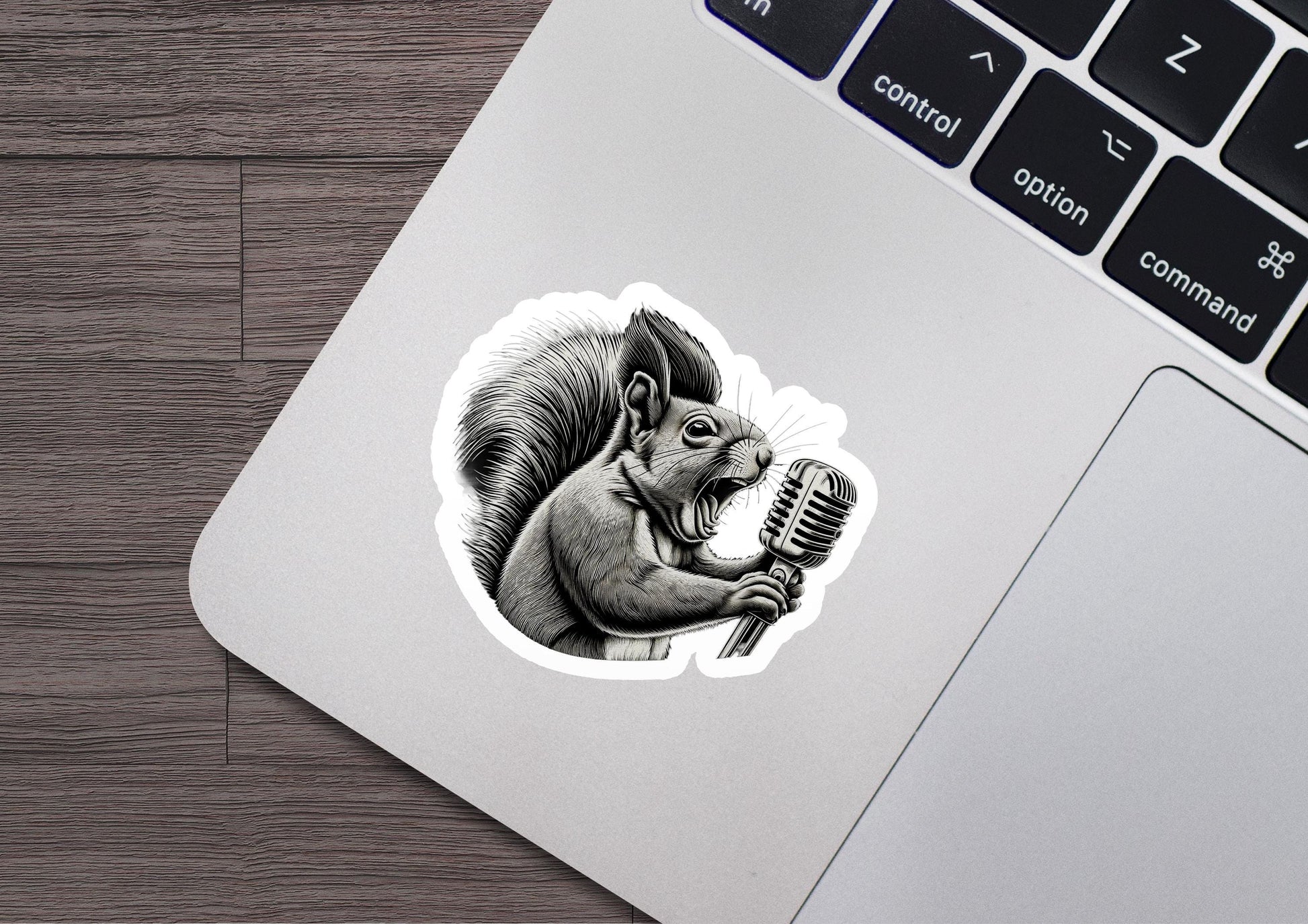 a sticker of a squirrel holding a microphone